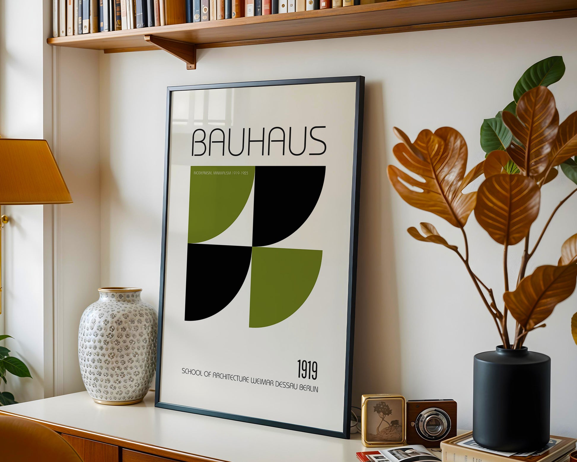 Framed Bauhaus poster on a shelf with decorative items