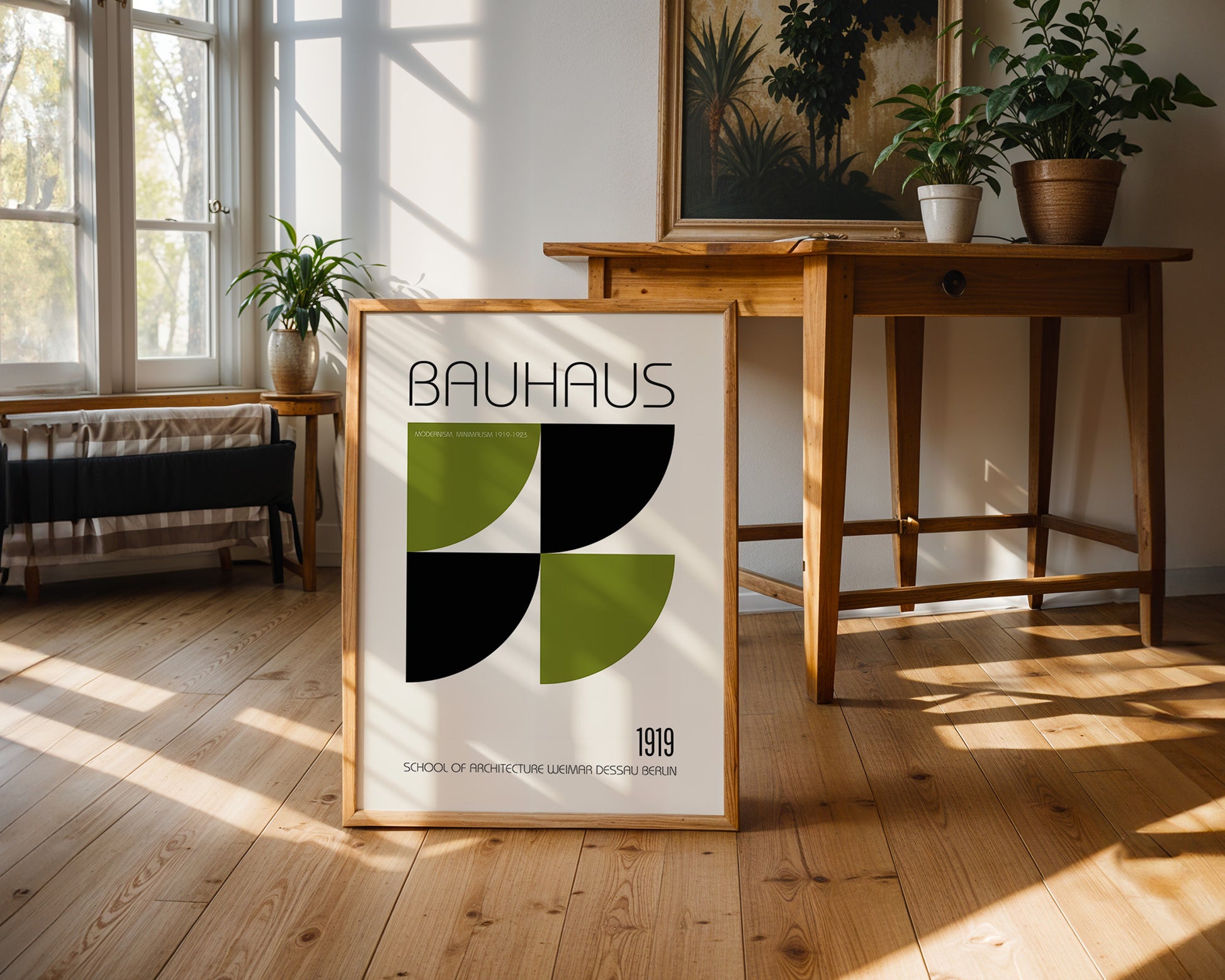 Bauhaus poster in a frame on a wooden floor with a table and plants in the background