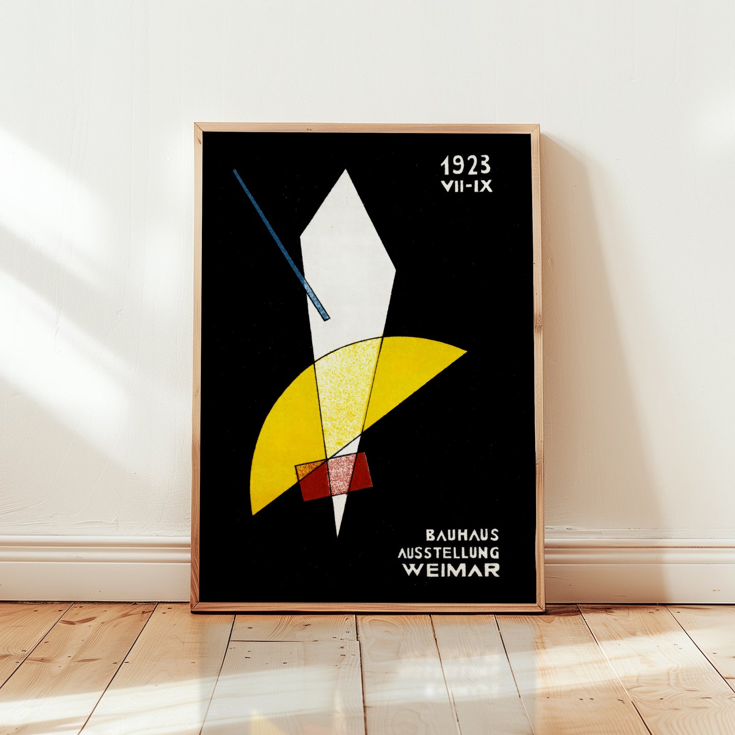 Framed bauhaus poster abstract art print with geometric shapes on a black background, displayed on a wall.