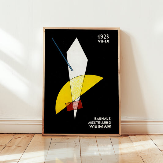 Framed bauhaus poster abstract art print with geometric shapes on a black background, displayed on a wall.