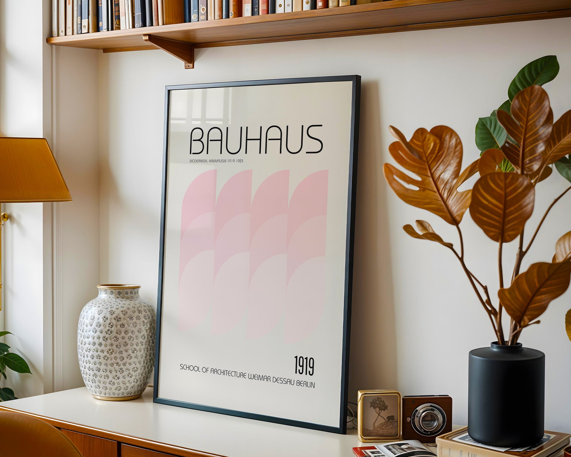 Framed Bauhaus poster on a shelf with decorative items