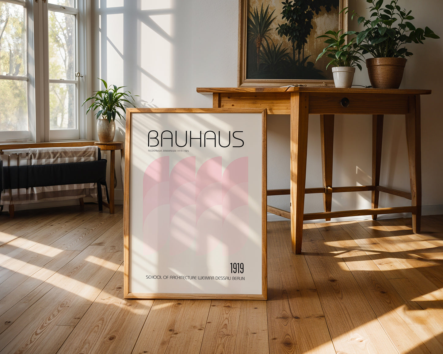 Bauhaus poster on a wooden floor with a table and plants in the background