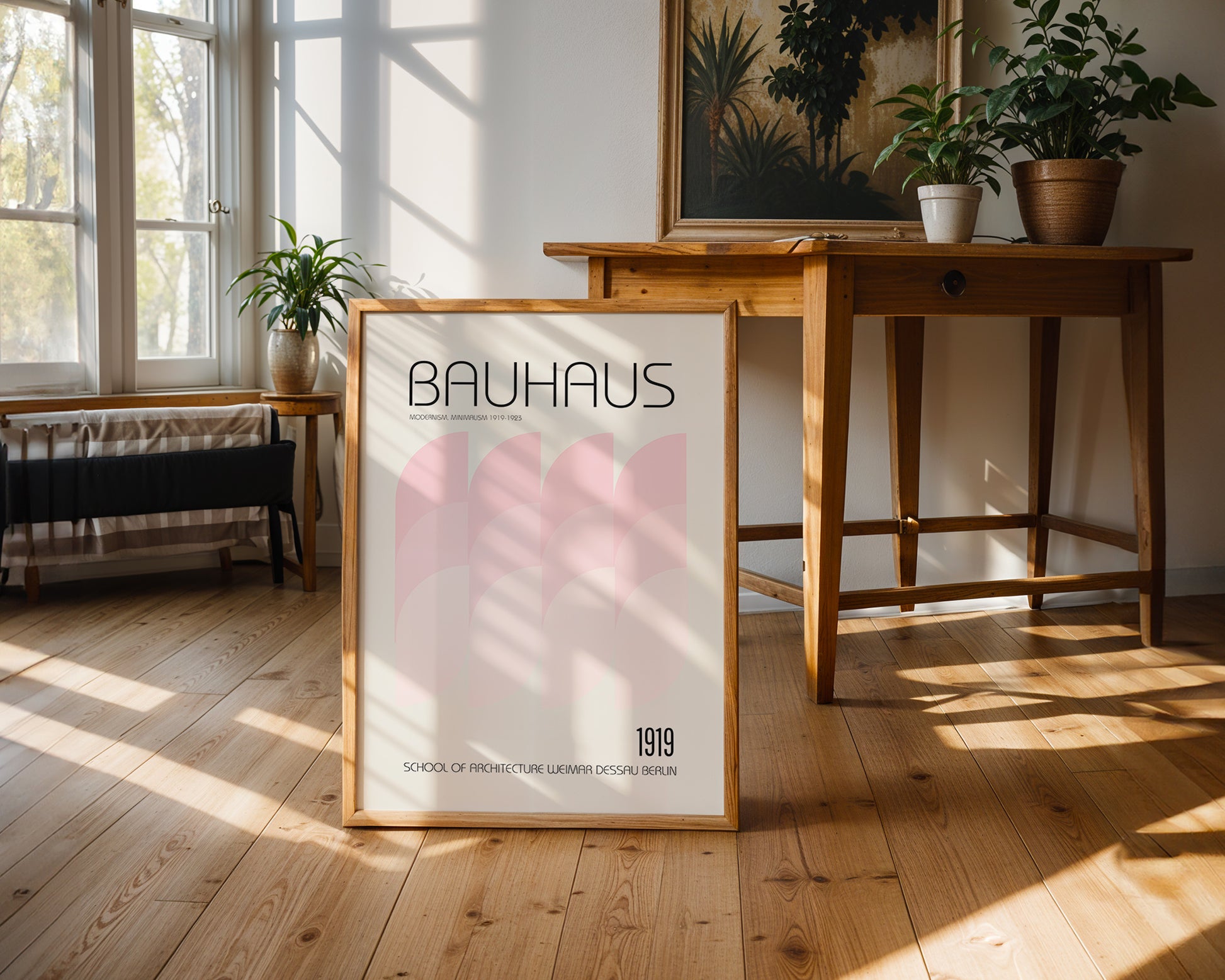 Bauhaus poster on a wooden floor with a table and plants in the background