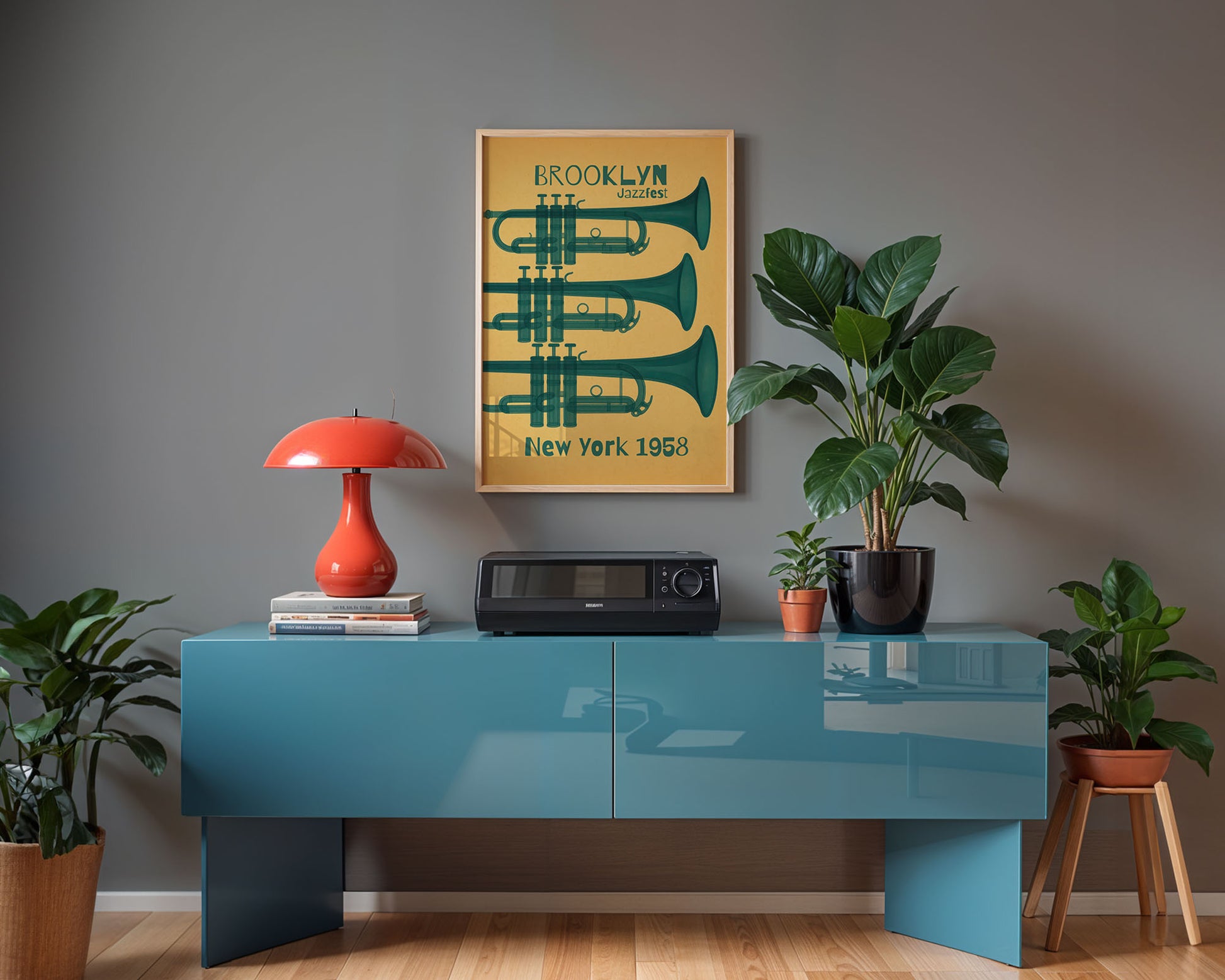 Modern interior with a blue console table, red lamp, and framed poster on a gray wall.