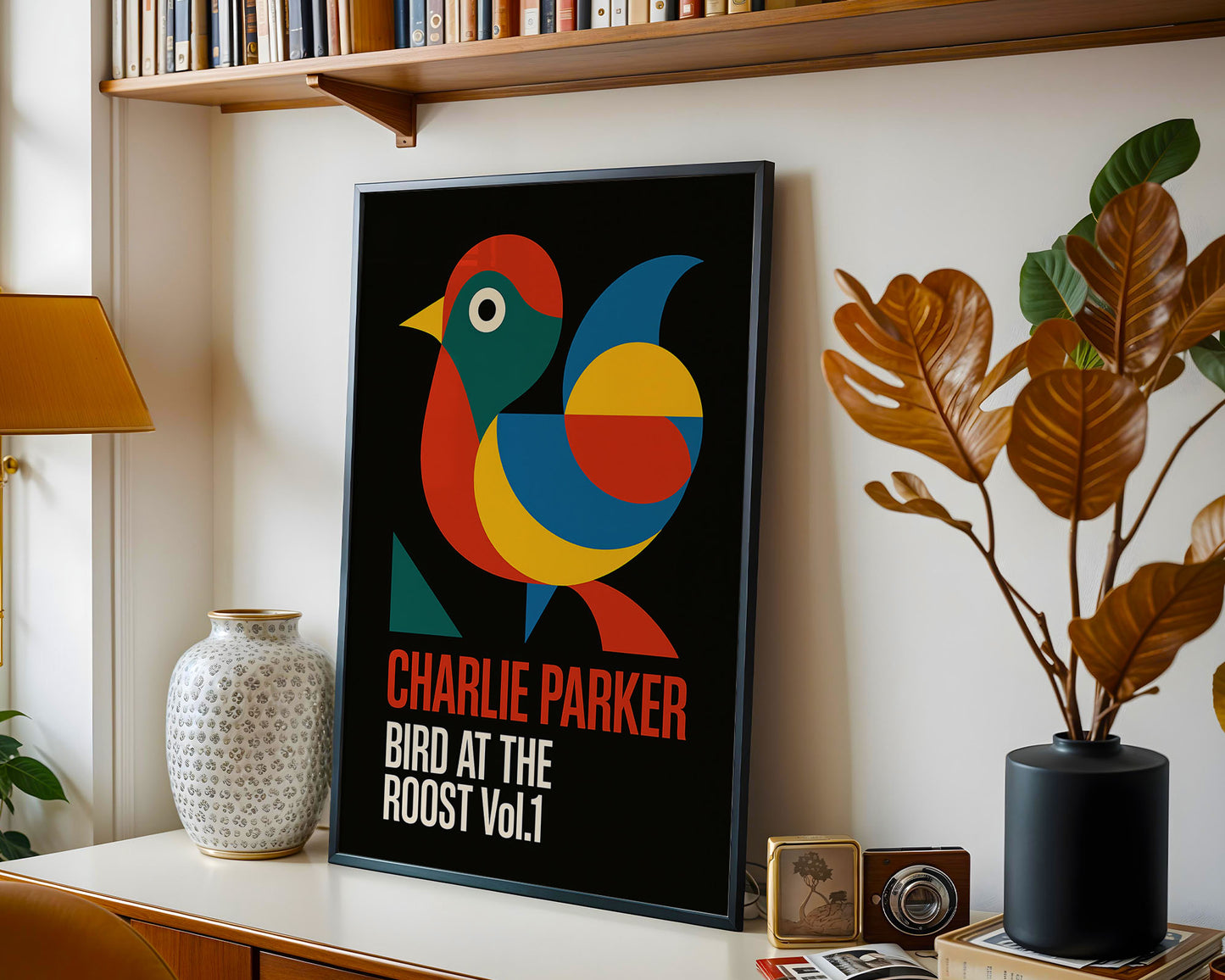 Framed poster of a colorful bird with text on a shelf with decorative items.