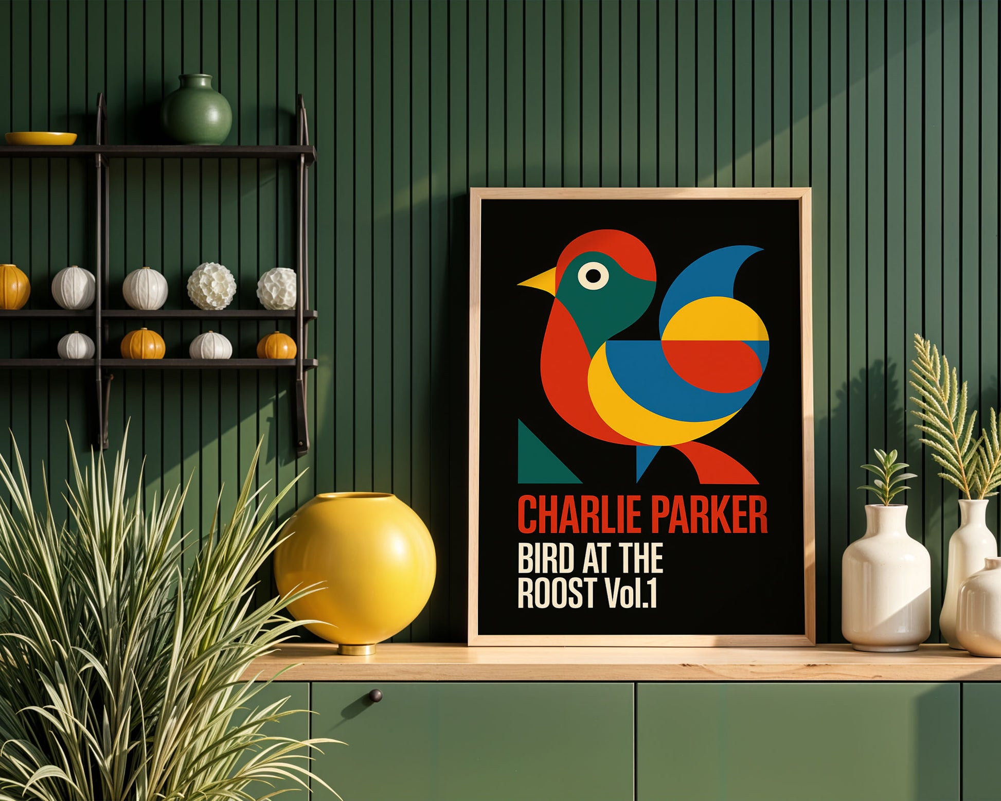Framed poster of a colorful bird with text 'Charlie Parker Bird at the Roost Vol. 1' on a wooden shelf against a green wall.