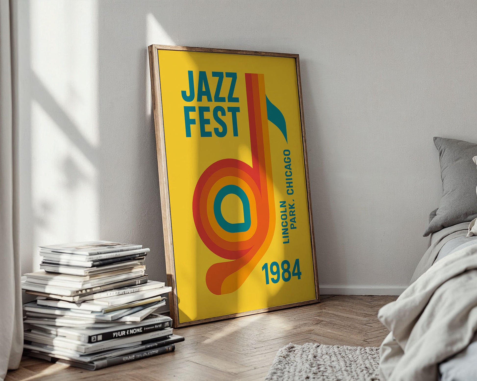 Framed 'Jazz Fest' poster on a wall next to a stack of books and a bed.