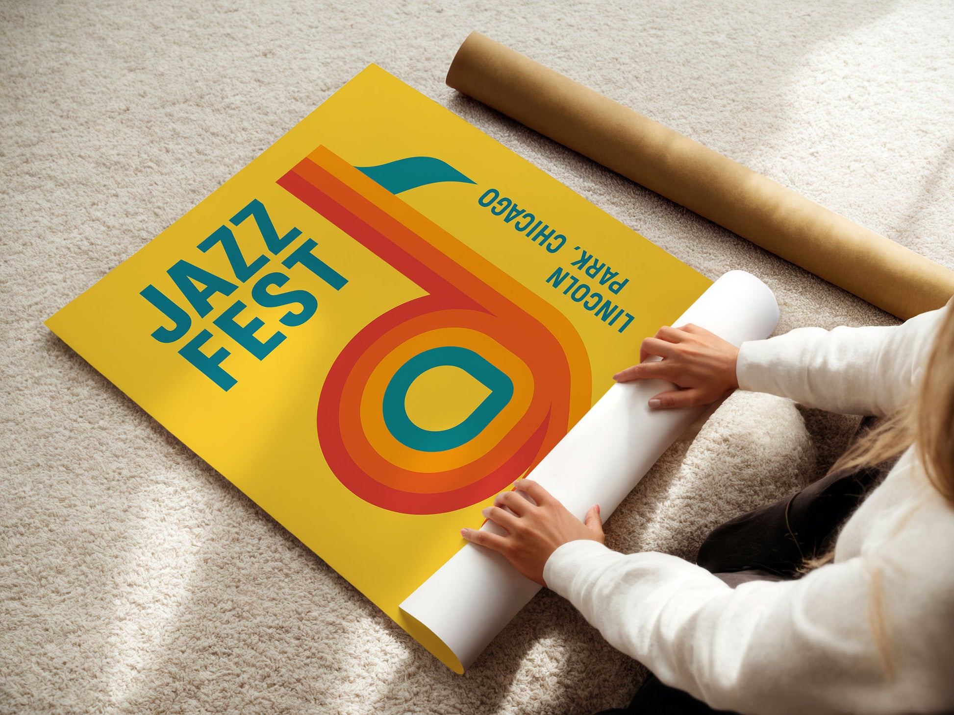 Person unrolling a large poster of Jazz Fest Chicago on a carpeted floor.