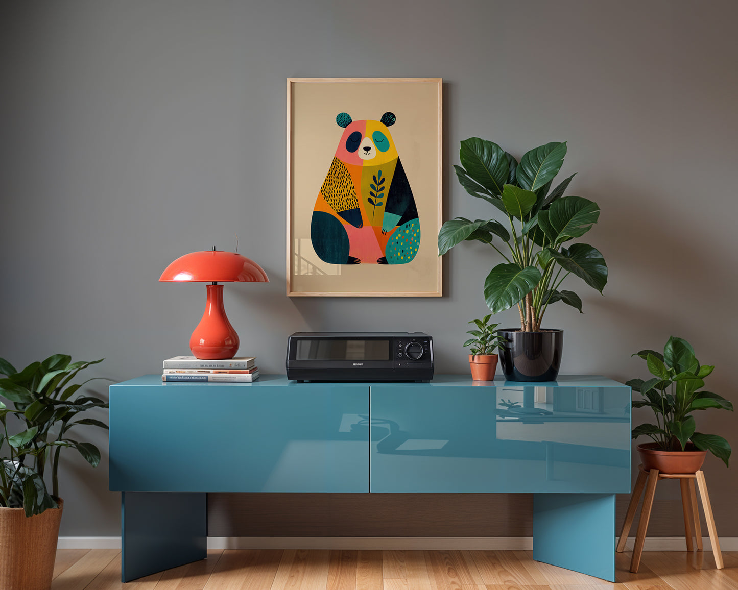 Modern interior with a blue console table, red lamp, and colorful bear artwork on a gray wall.