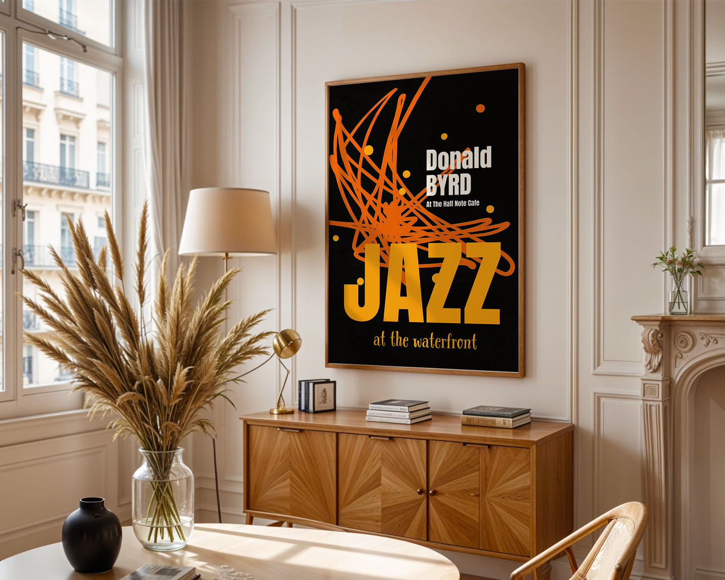 Living room with a 'Donald Byrd Jazz' poster on the wall, wooden cabinet, and decorative items.