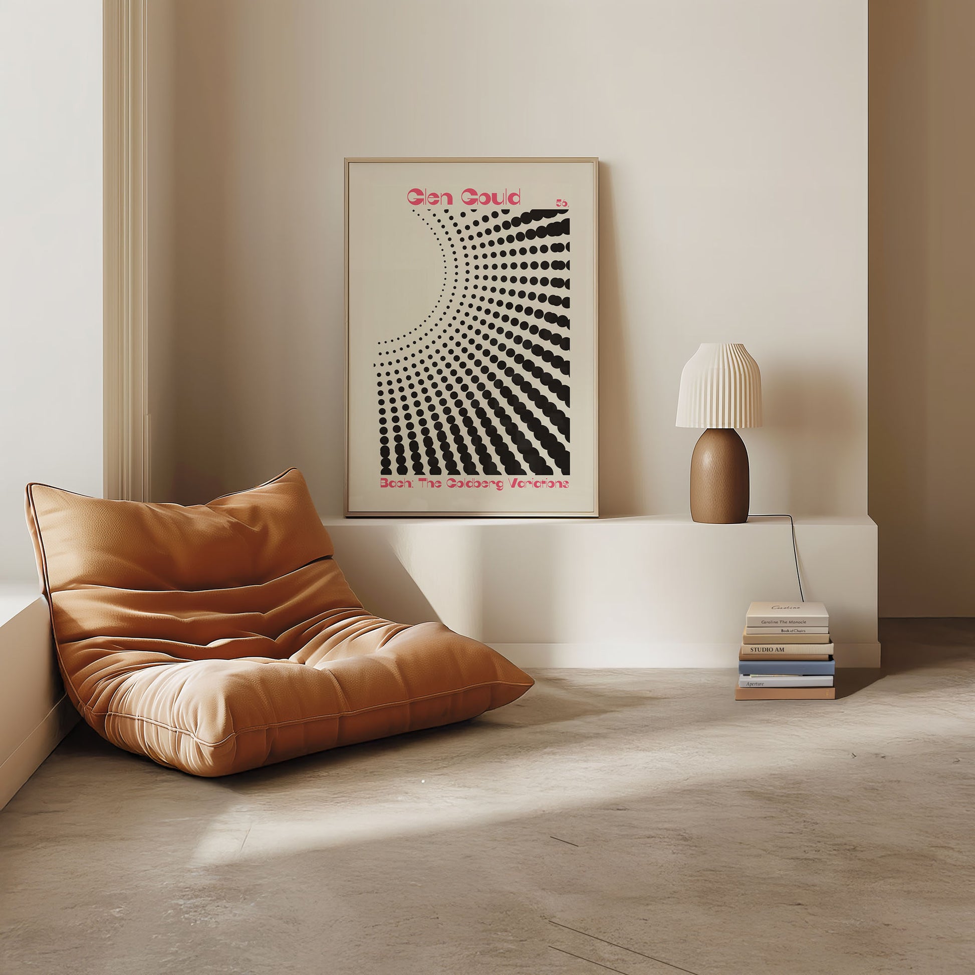 Modern interior with a brown cushion on the floor, a lamp, and a framed artwork on the wall.