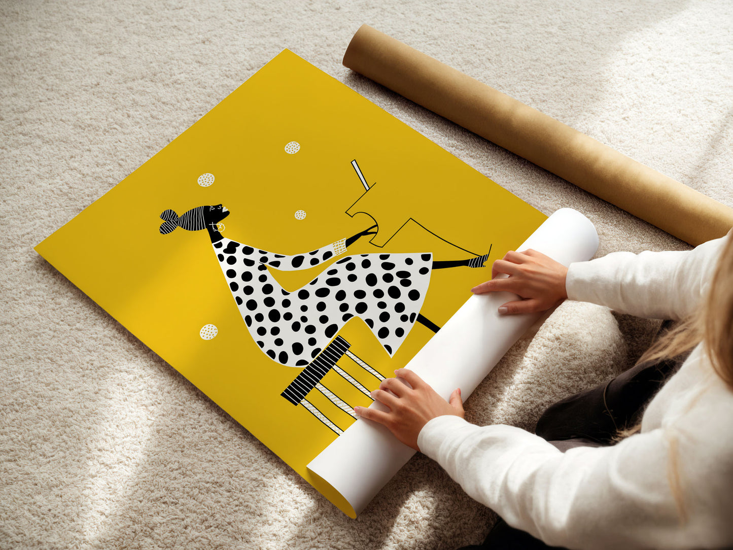 Person unrolling a yellow Jazz poster with a black and white polka dot design on a beige carpet.