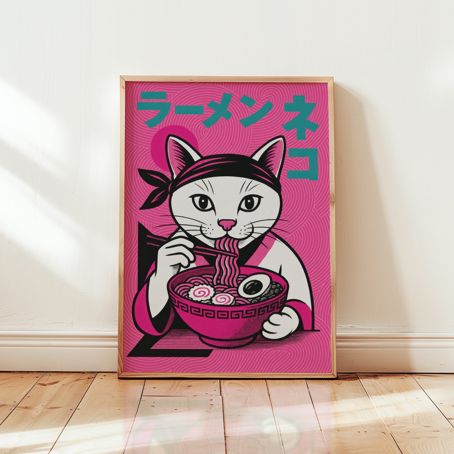 Framed ramen cat Japanese art print in wooden frame, bold magenta pink illustration with white cat eating ramen and teal katakana typography