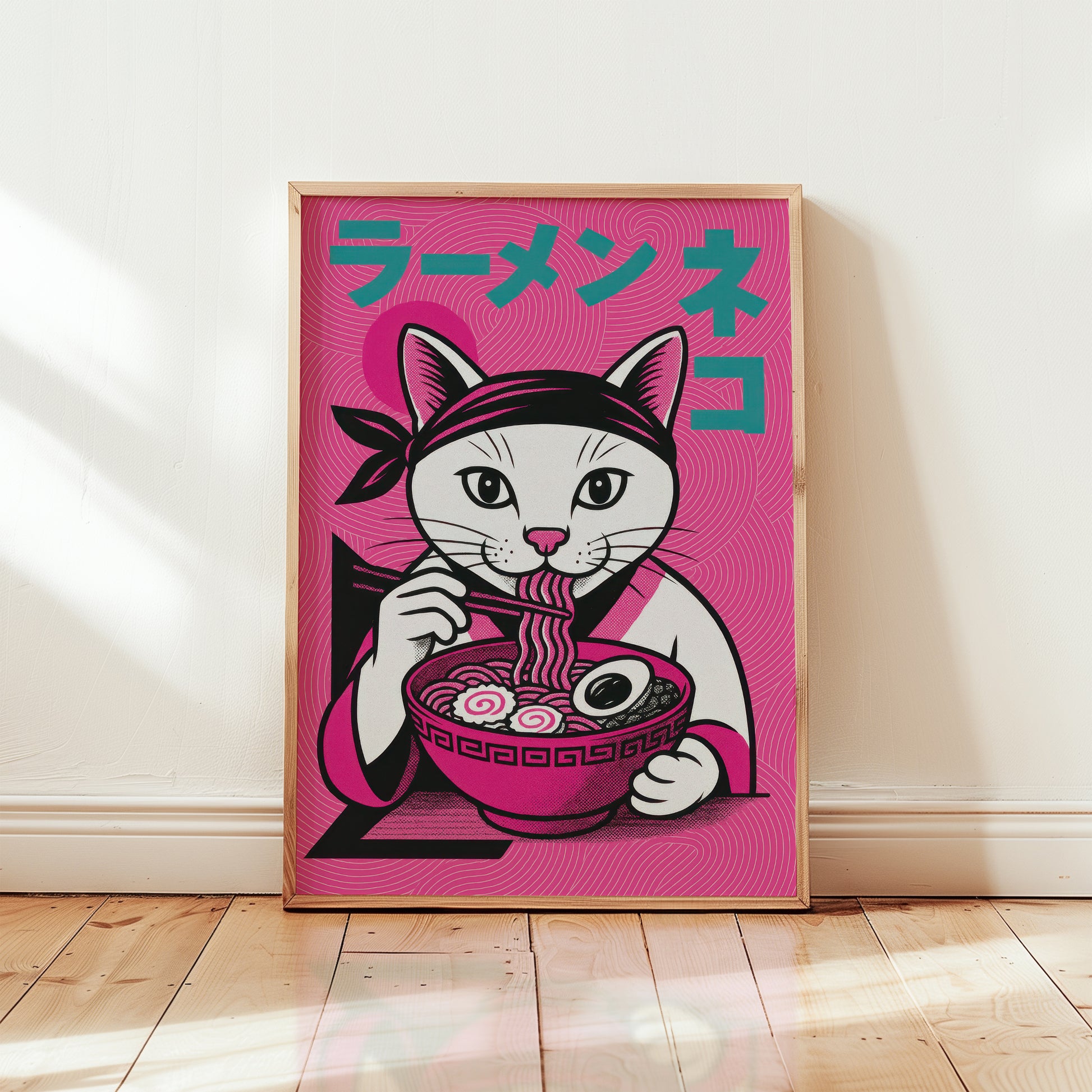 Framed ramen cat Japanese art print in wooden frame, bold magenta pink illustration with white cat eating ramen and teal katakana typography