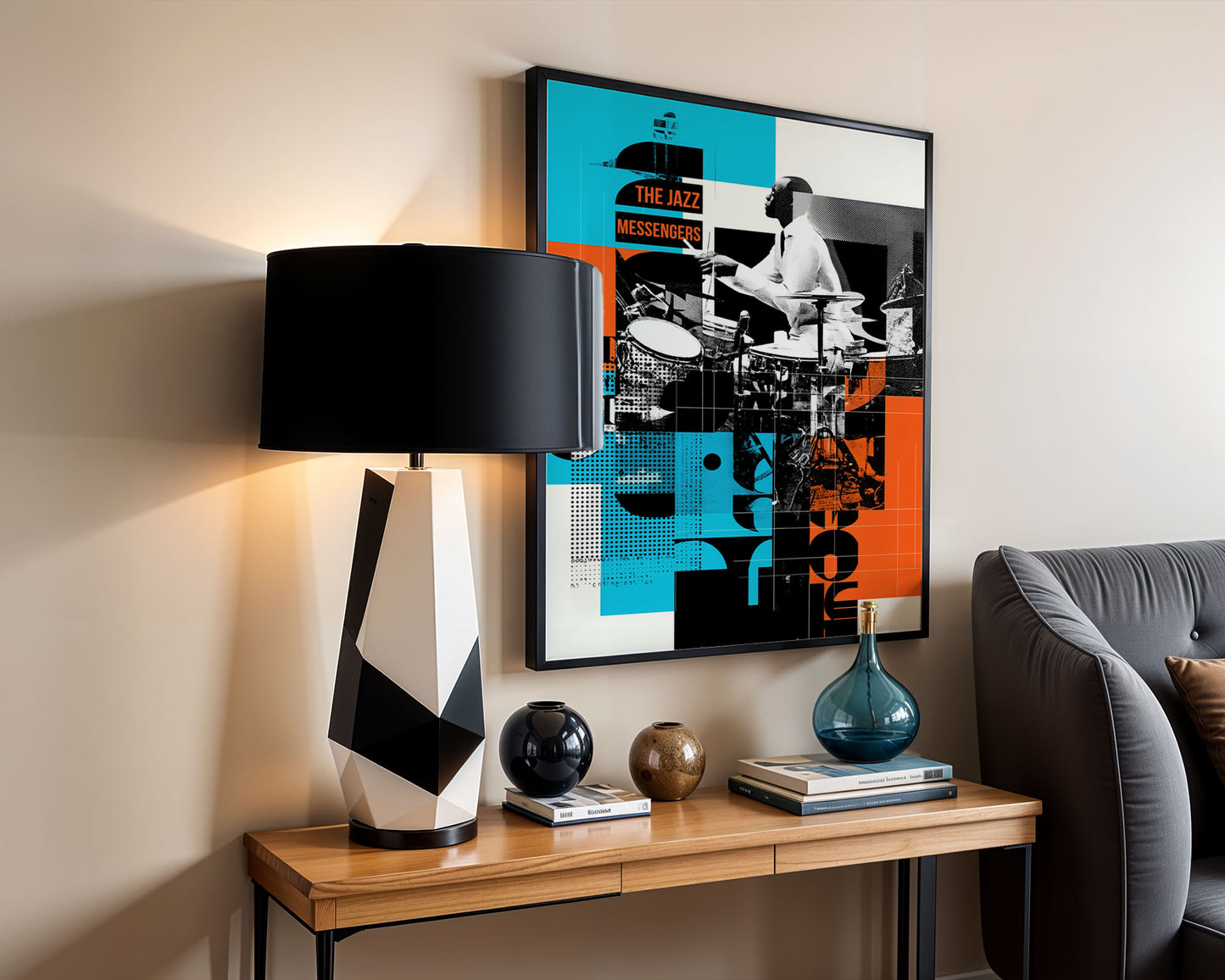 Modern eclectic home decor interior with a lamp, framed artwork, and decor items on a wooden console table.