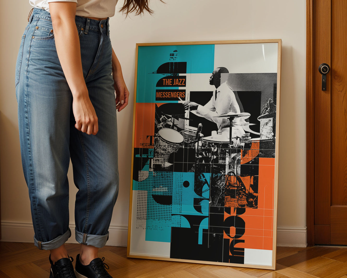 Person standing next to a framed poster of jazz musicians on a wall.