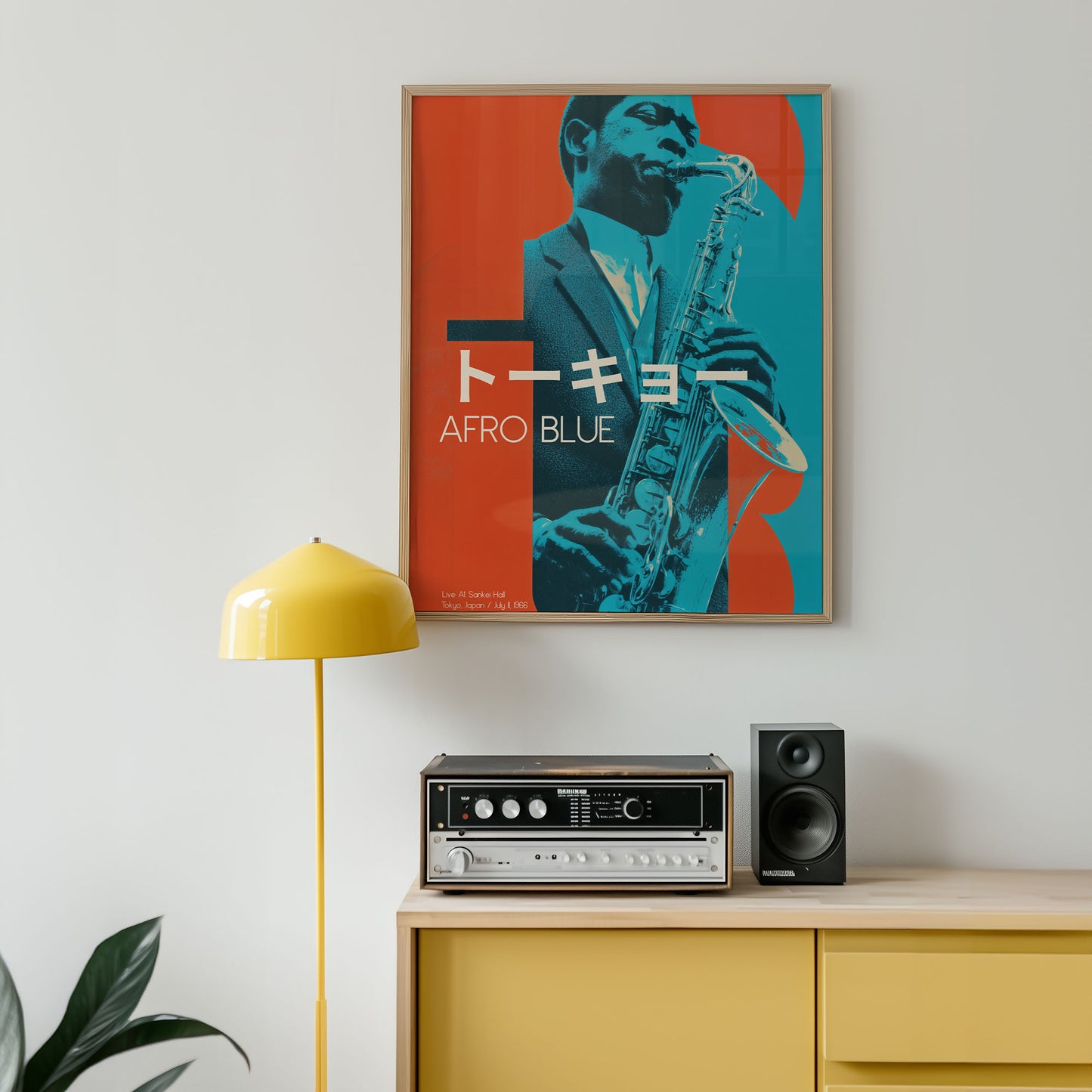 Framed poster of a saxophonist with 'Afro Blue' text on a wall above a yellow cabinet with stereo equipment.