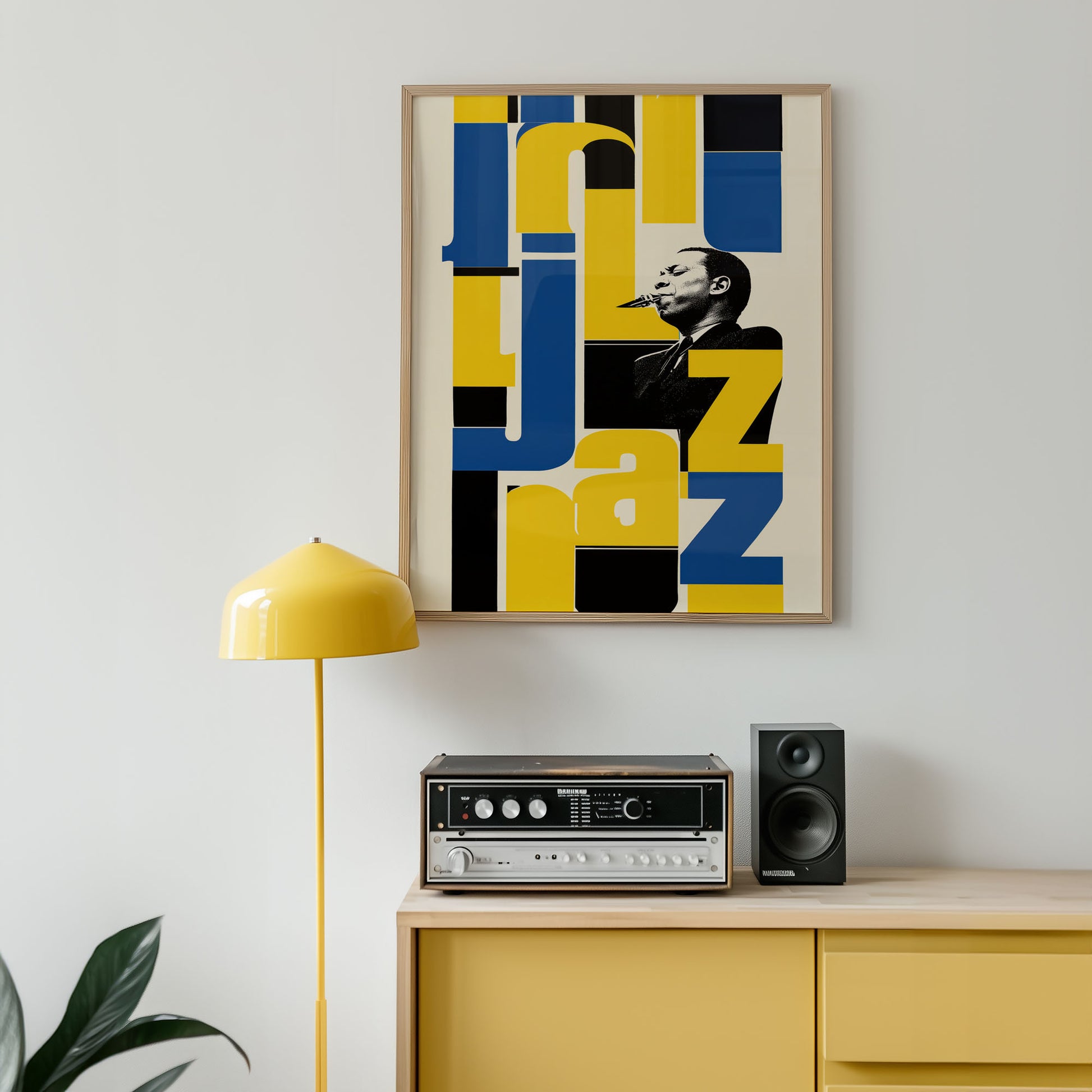 Framed jazz-themed artwork above a yellow cabinet with stereo equipment.