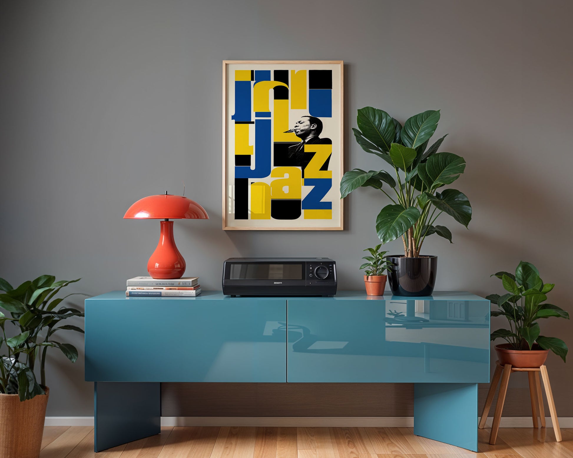 Modern interior with a blue console table, red lamp, and decorative items against a gray wall.
