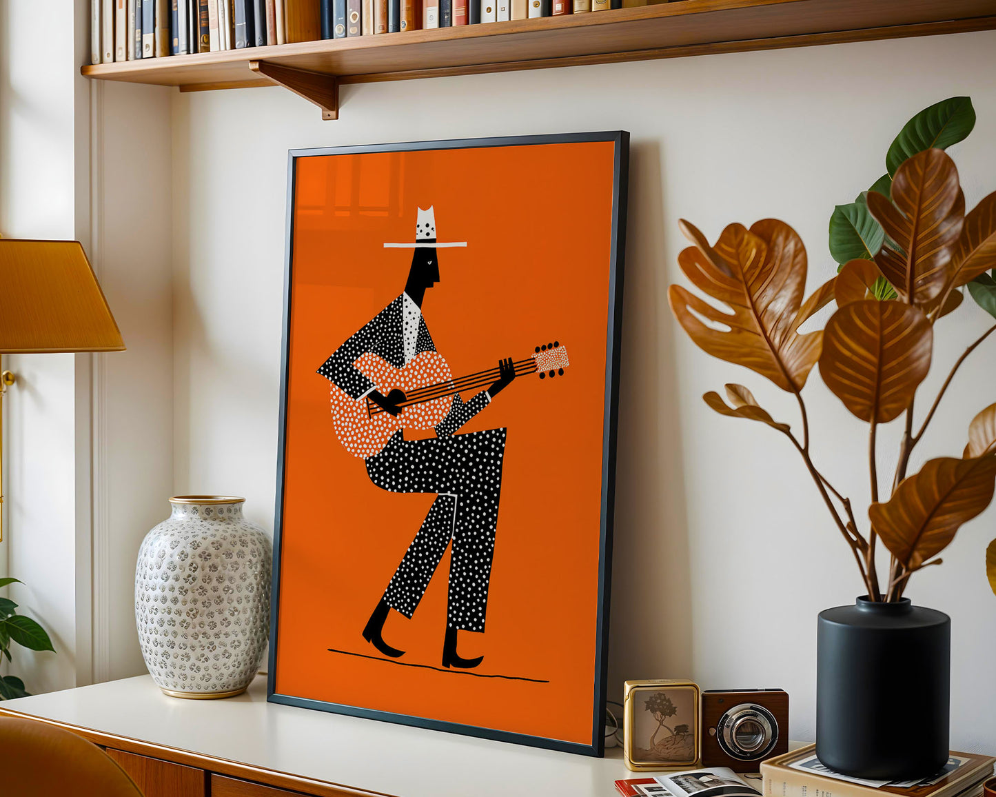 Framed mid-century style Guitarist wall art print styled against minimalist interior wall
