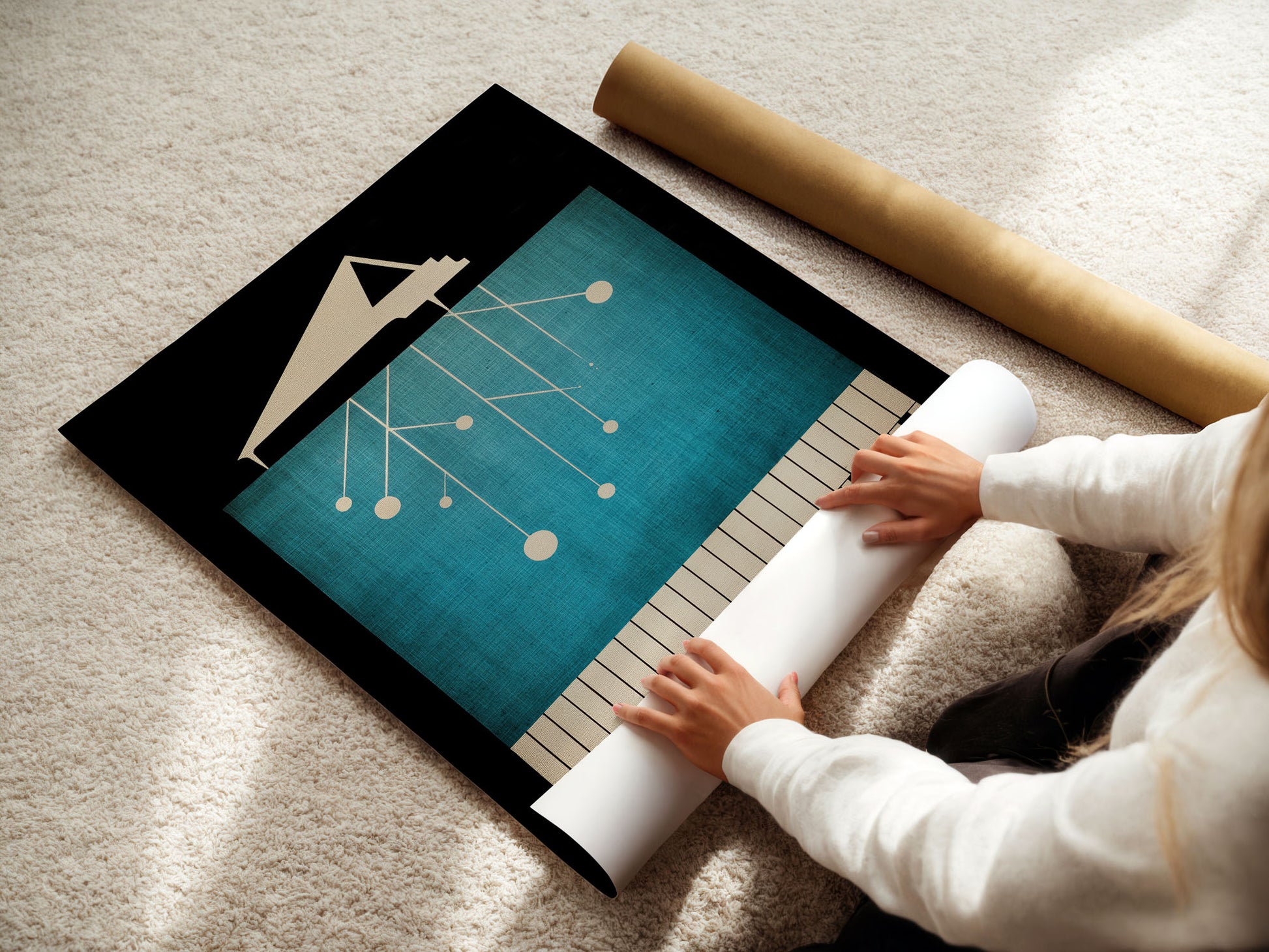 Woman unrolling a large abstract music poster with a design on a carpeted floor