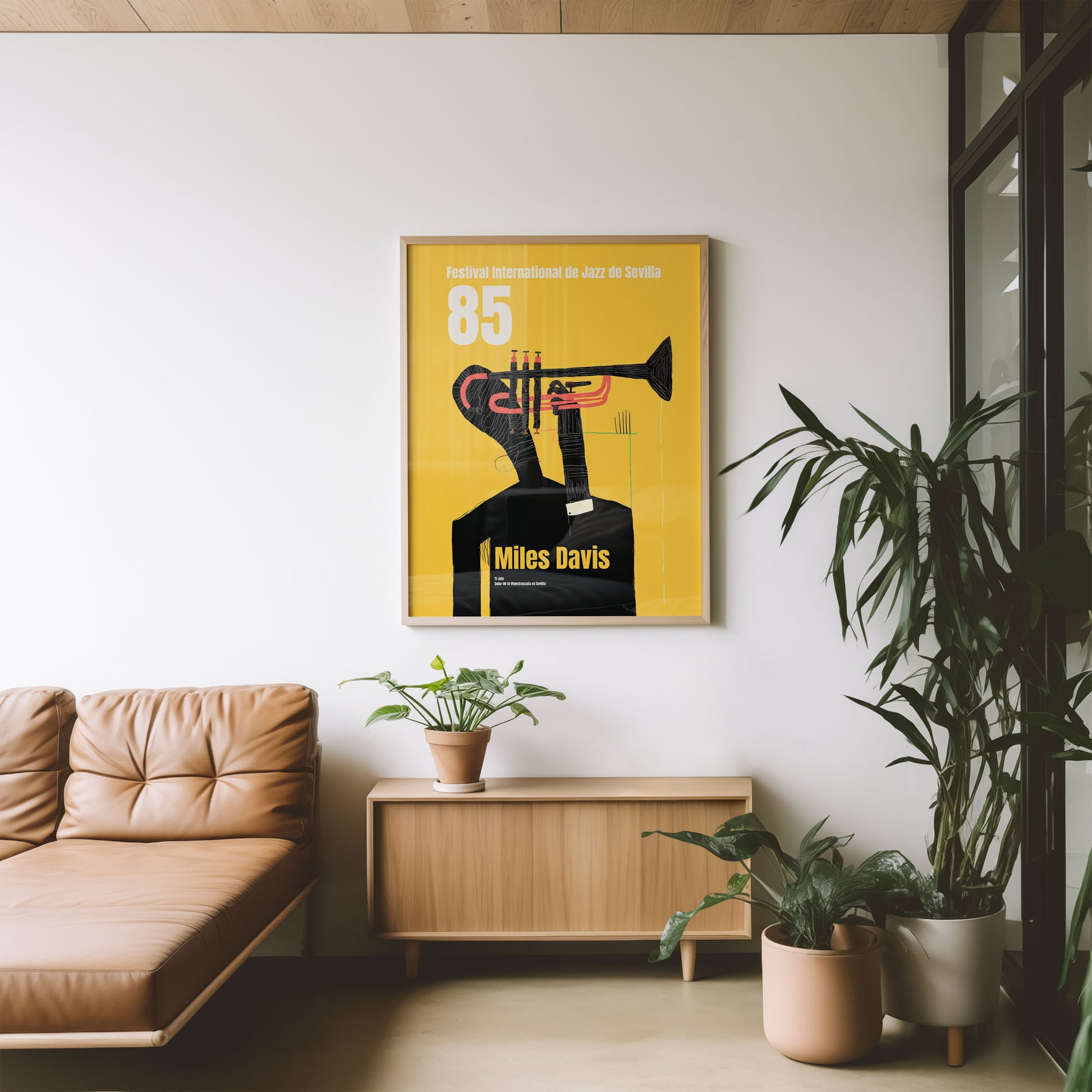 Living room with a framed poster of Miles Davis on a yellow background, beige sofa, wooden cabinet, and potted plants.