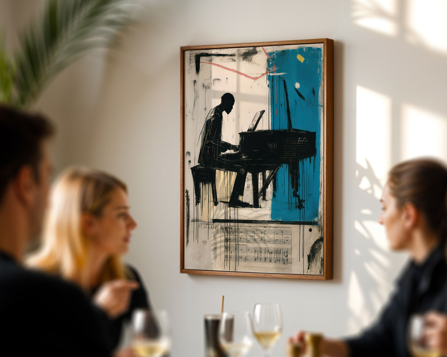 Framed artwork of a person playing a piano on a wall in a social setting.