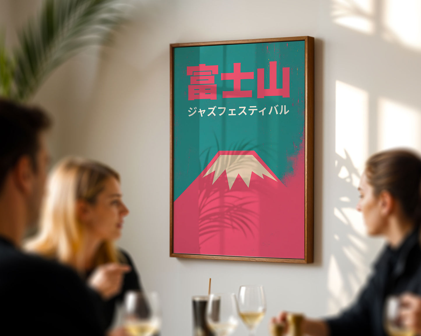 Framed poster with Japanese text and mountain design on a wall in a social setting.