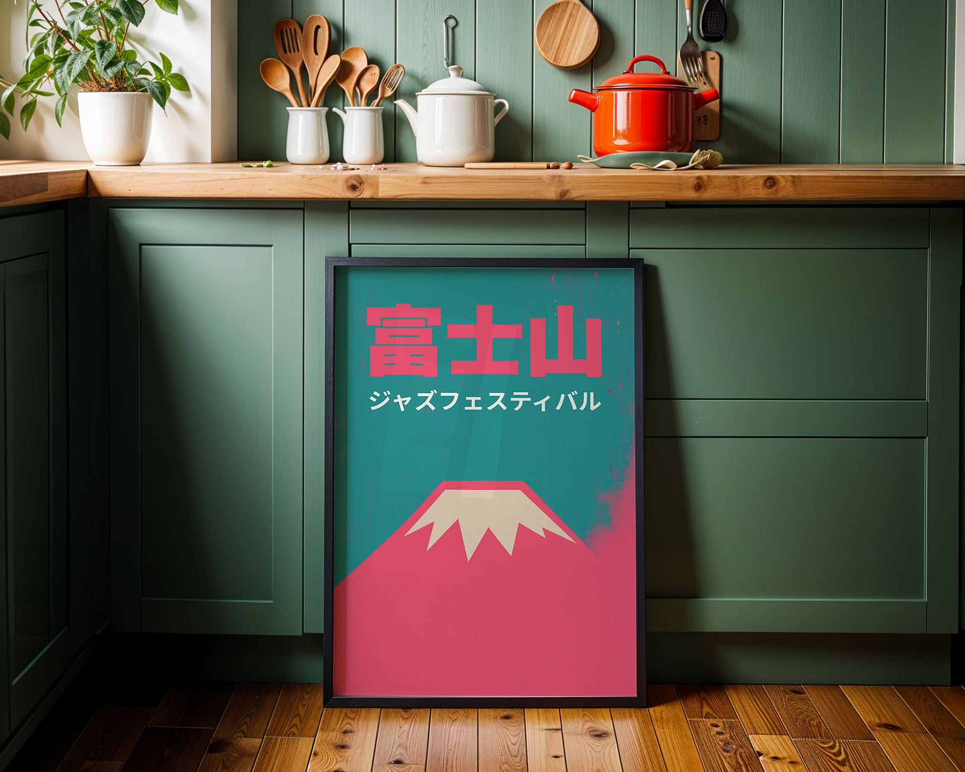 Framed artwork with a mountain design and Japanese text in a kitchen setting