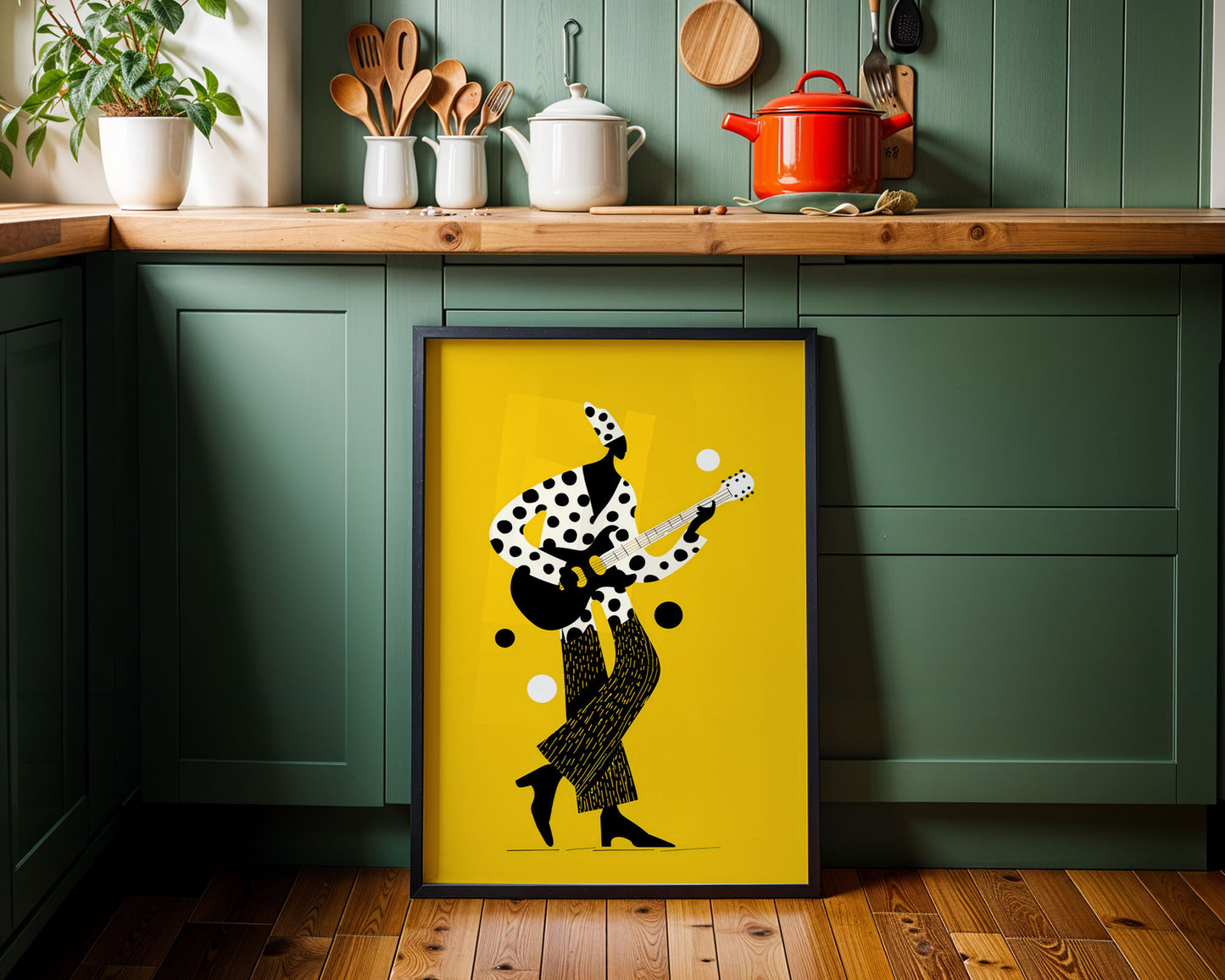 Framed artwork of a person playing guitar on a yellow background in a kitchen.