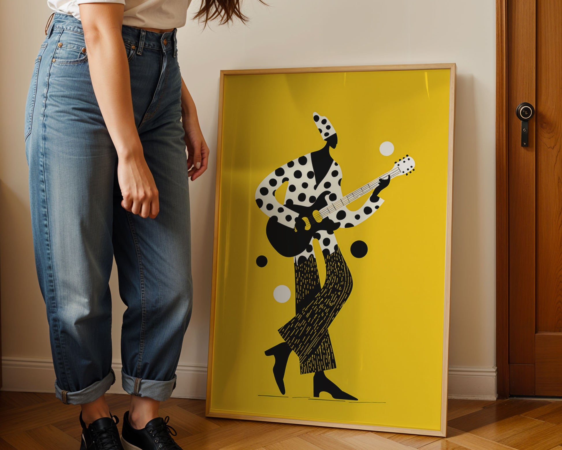 young woman Person standing next to a framed Mardi Grasabstract artwork on a yellow background