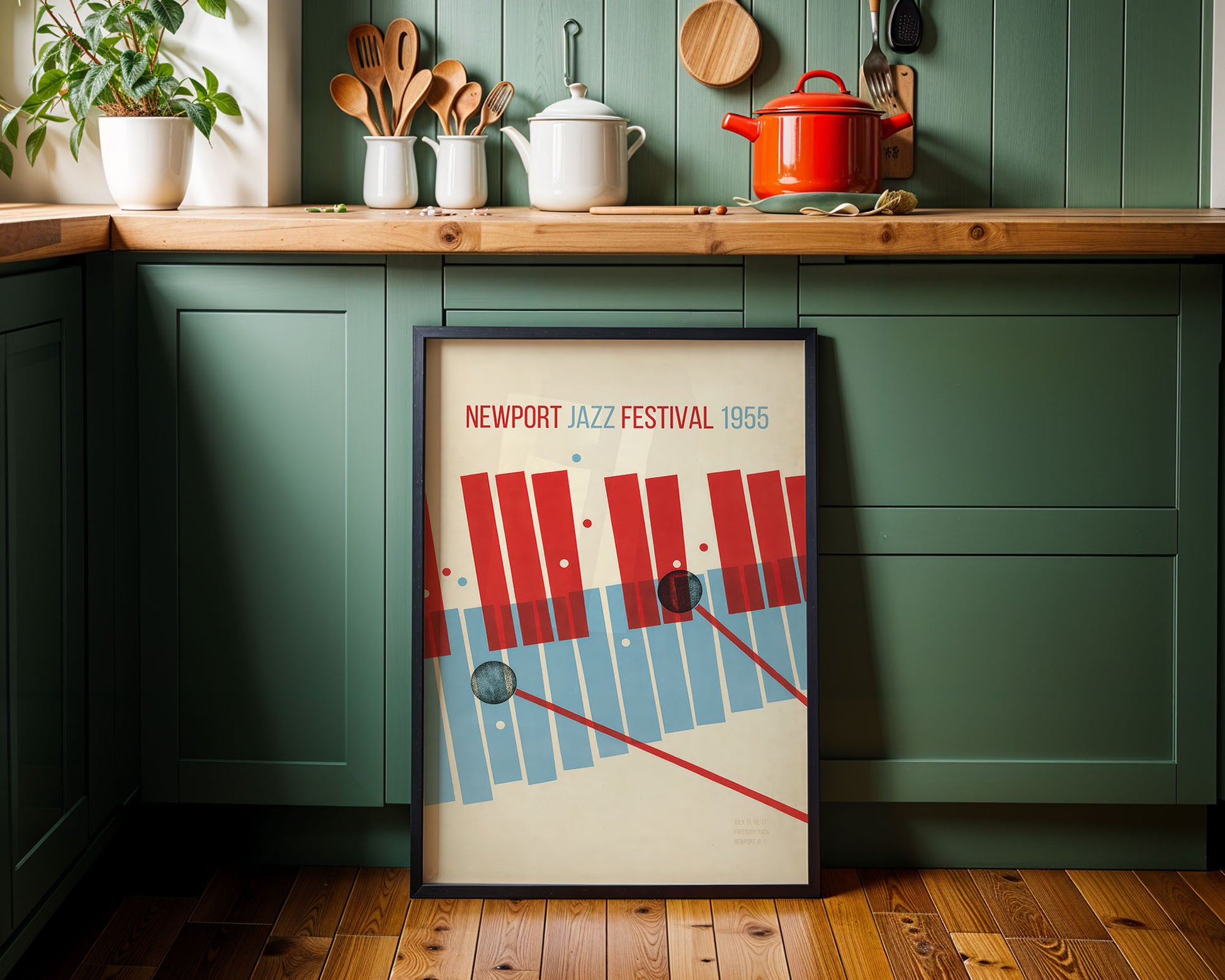 Framed poster of the Newport Jazz Festival 1966 in a kitchen setting with green cabinets and wooden countertops.