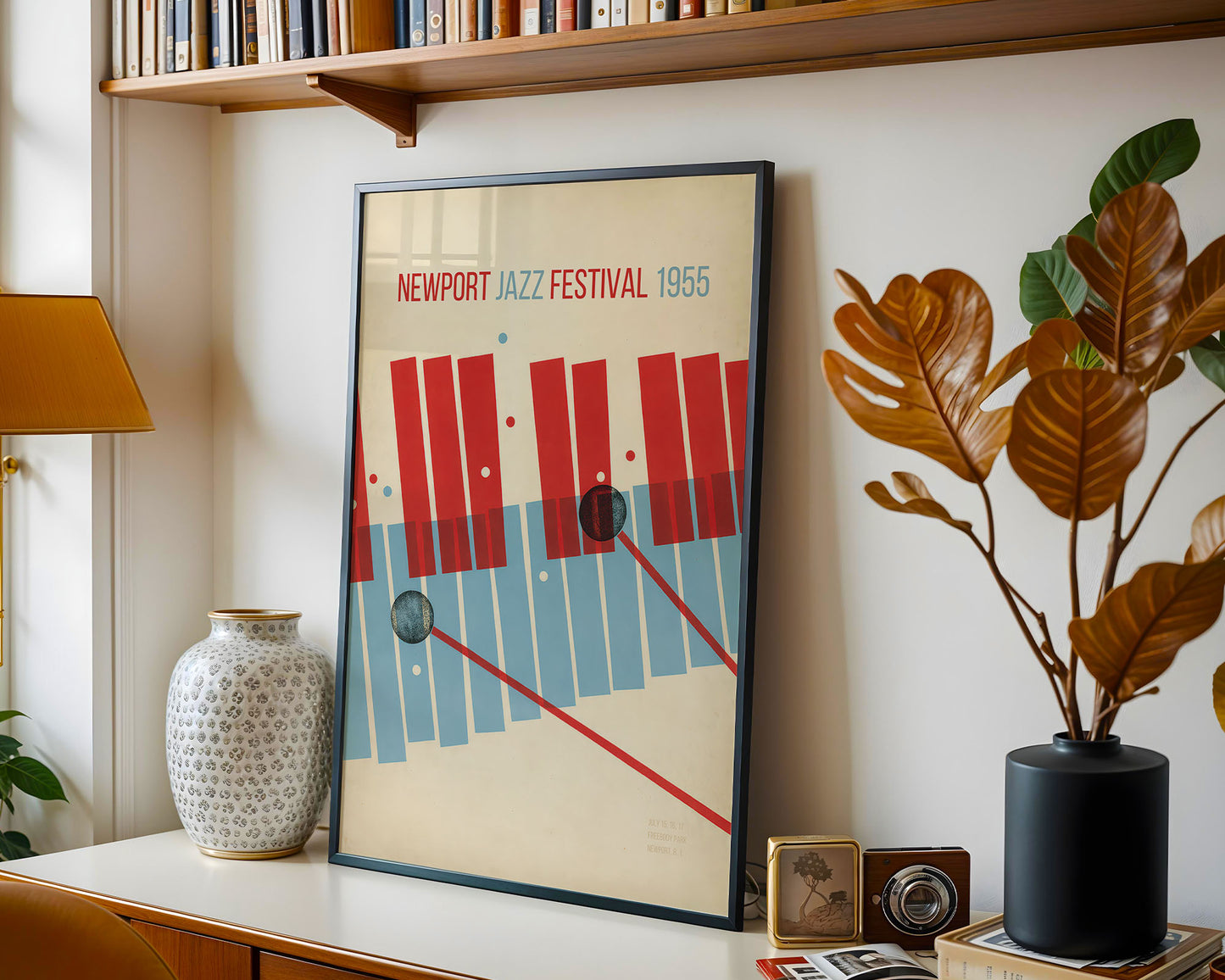Framed poster of the Newport Jazz Festival 1965 on a shelf with decorative items.
