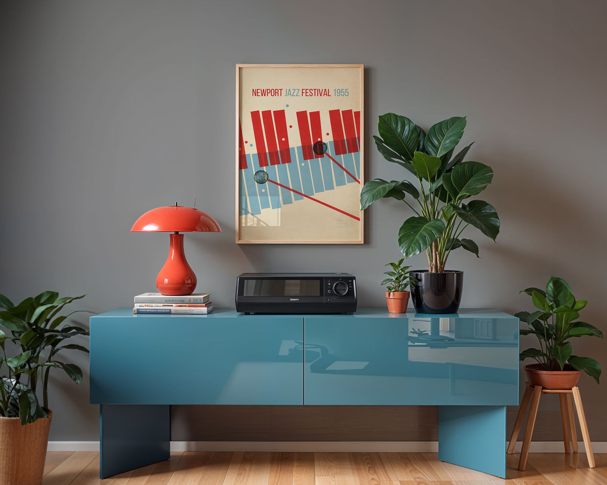 Modern interior with a blue console table, red lamp, and framed poster on a gray wall.