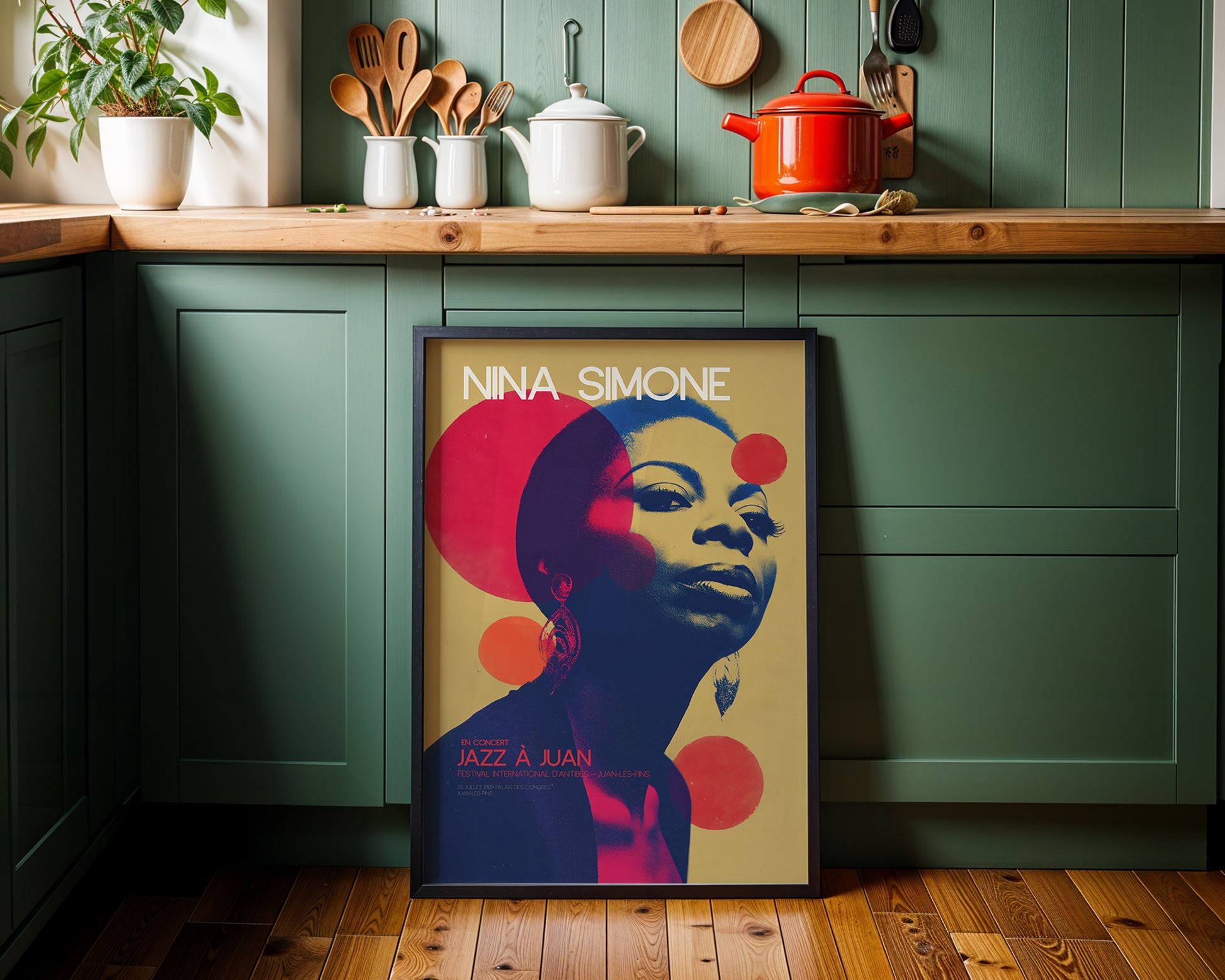 Mid-century modern wall art in a kitchen with green walls and wooden countertops.