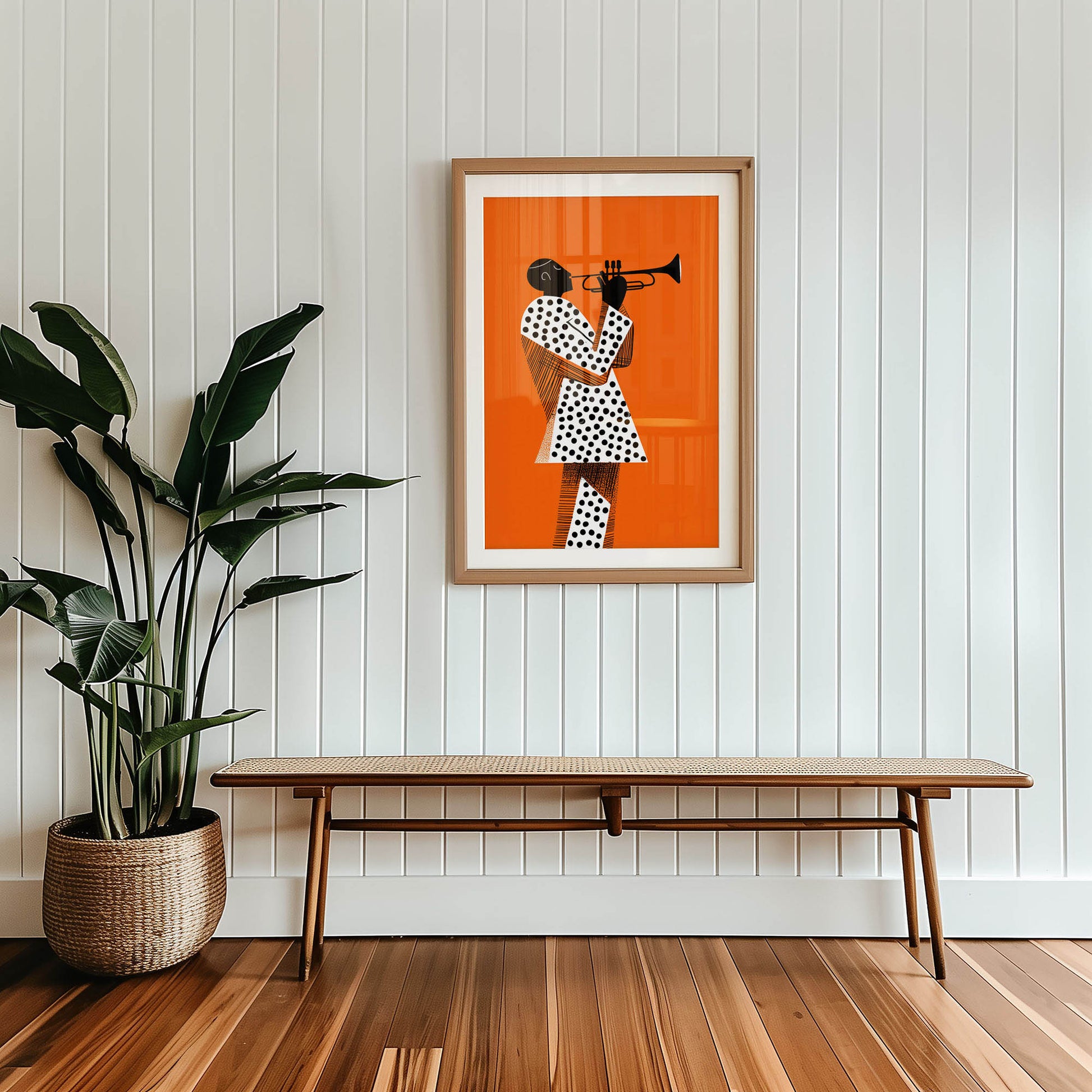 Framed artwork of a person playing a trumpet on an orange background, Mid-century modern wall art print featured in neutral interior design space