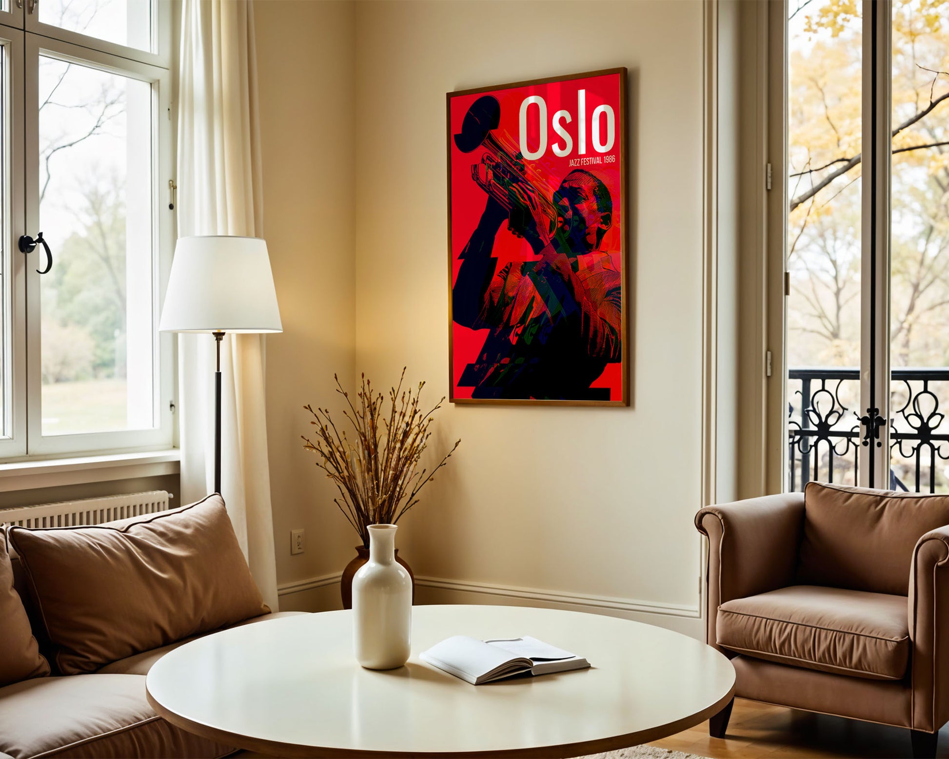 Living room with a 'Oslo' poster on the wall, a round table with a vase and book, and a brown sofa.