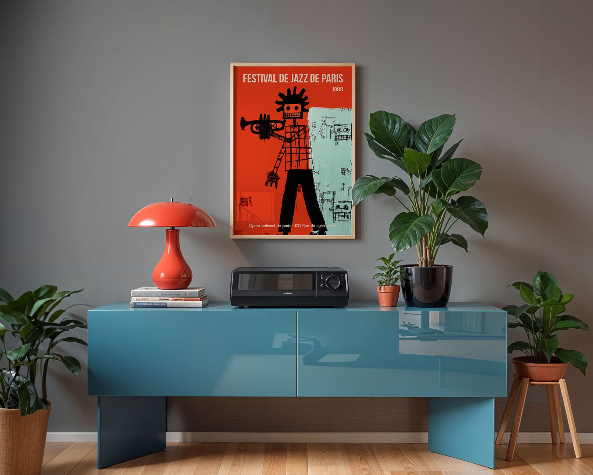 Modern interior with a blue console table, red lamp, and jazz poster on a gray wall.