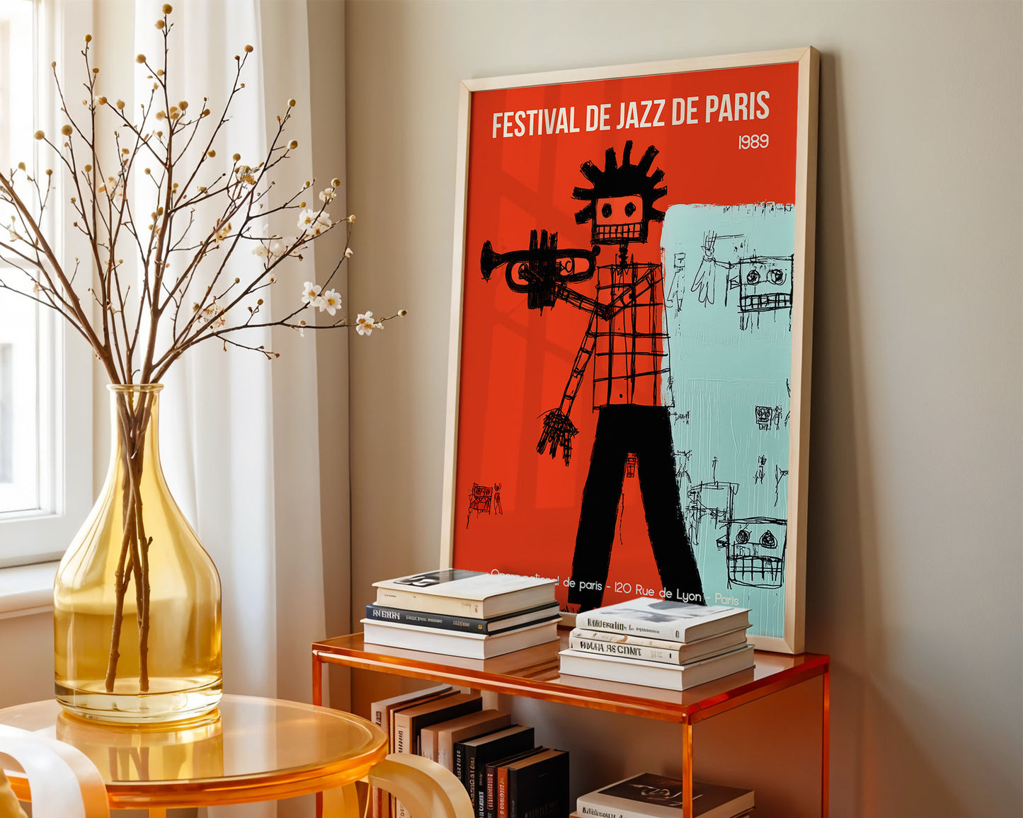Framed poster of Festival de Jazz de Paris on a shelf with books and a vase.