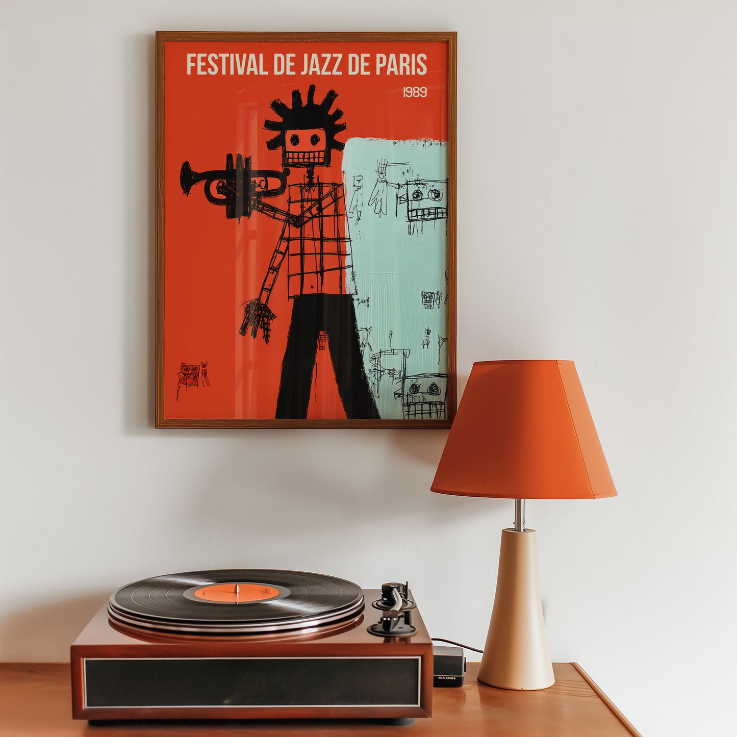 Framed poster of 'Festival de Jazz de Paris' above a record player with an orange lamp.