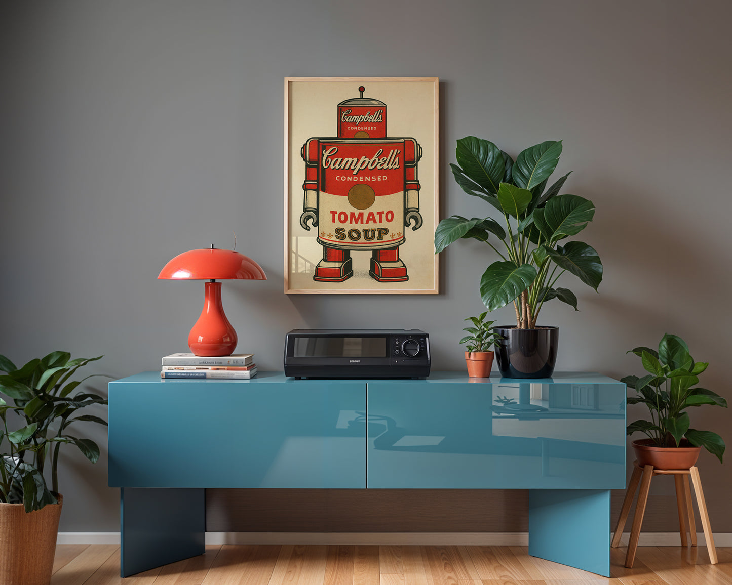 Modern interior with a blue console table, red lamp, and Campbell's Soup poster.