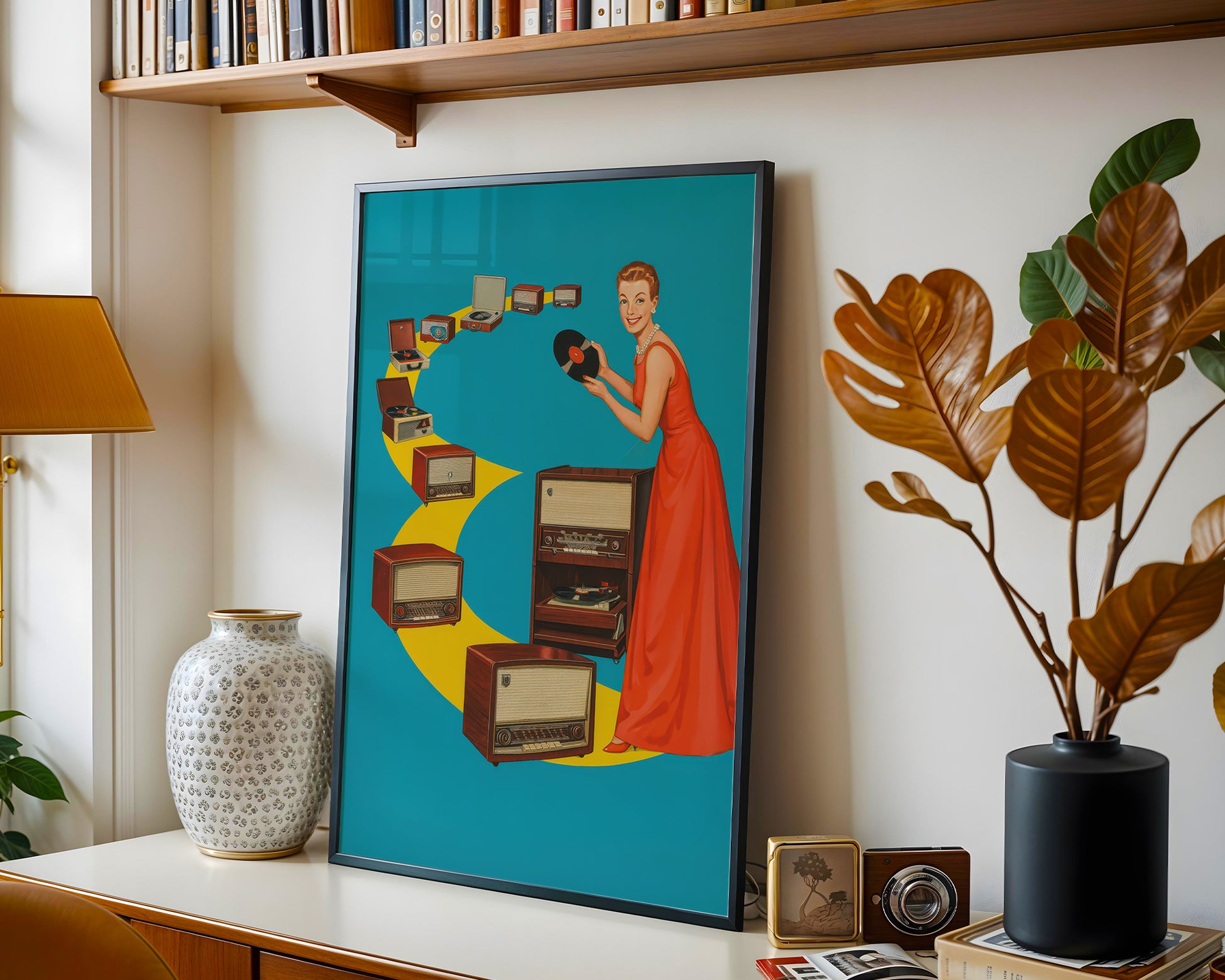 Framed artwork of a woman in a red dress with vintage radios on a shelf with books and decor.