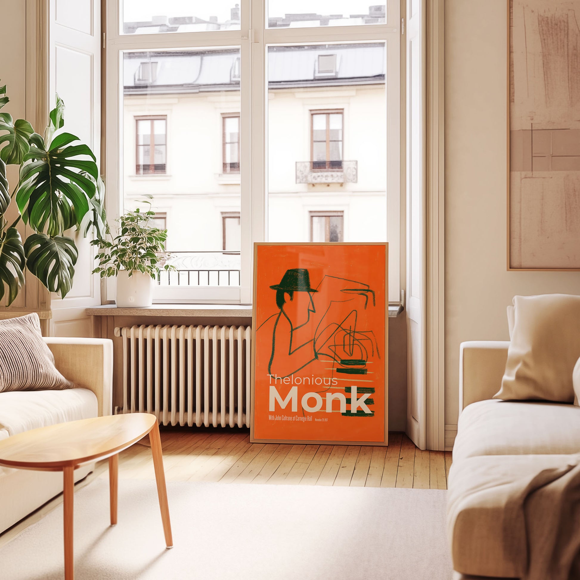 Living room with a bookshelf displaying a book titled 'Thelonious Monk'.
