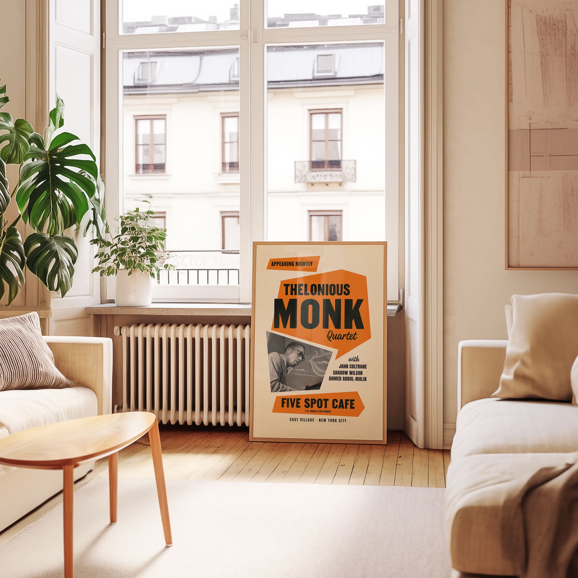 Living room with a large wall art poster of Thelonious Monk in a stylish home setting.