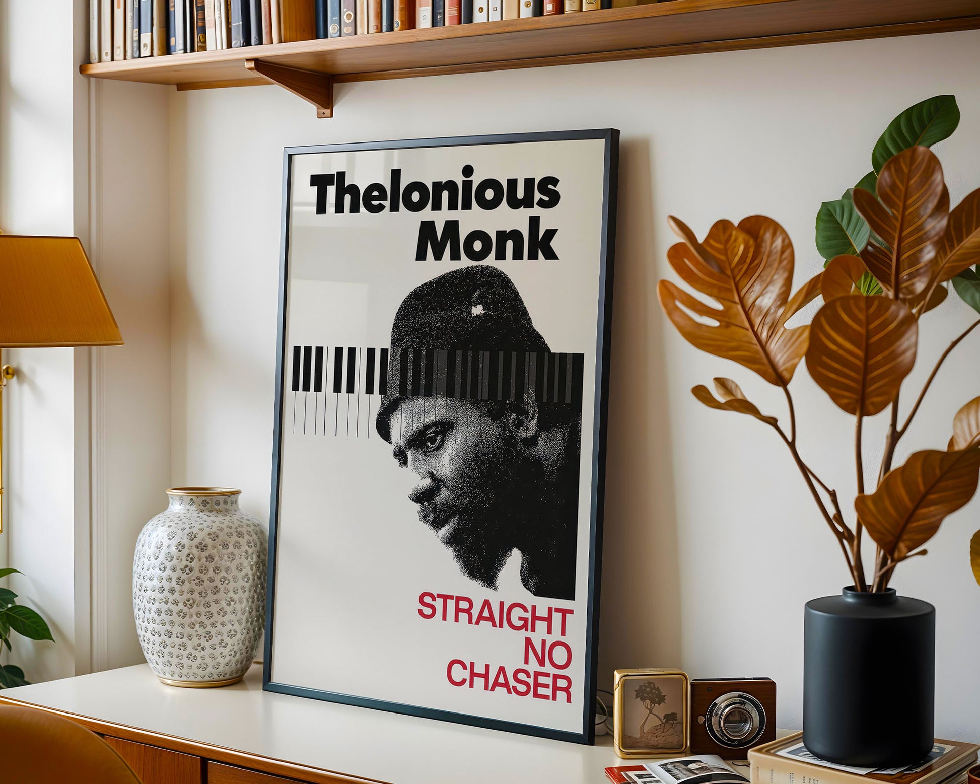 Framed poster of Thelonious Monk on a shelf with decorative items.