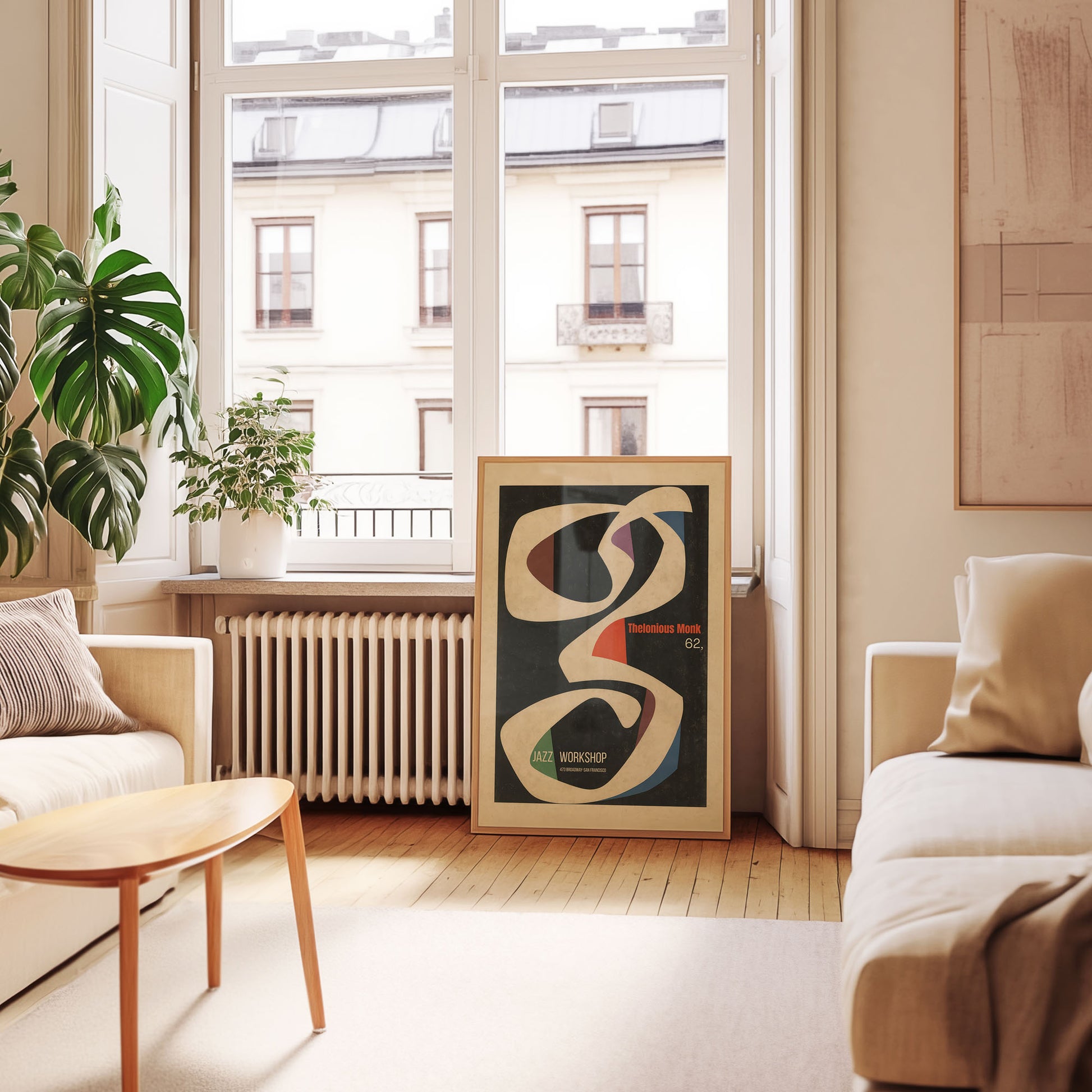 Framed mid-century style wall art print styled against minimalist interior wall