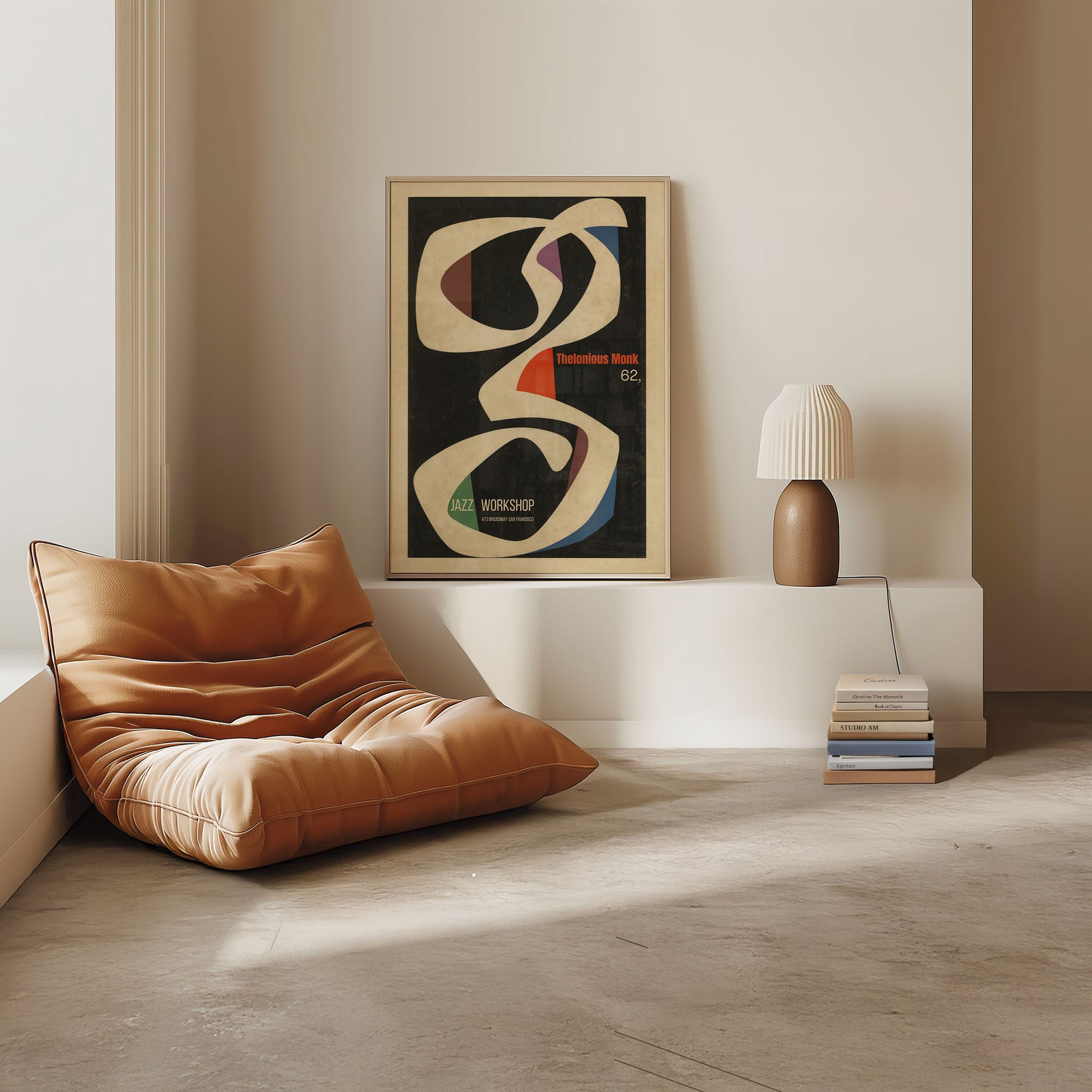 Modern living room with brown leather chair, abstract art, and lamp.