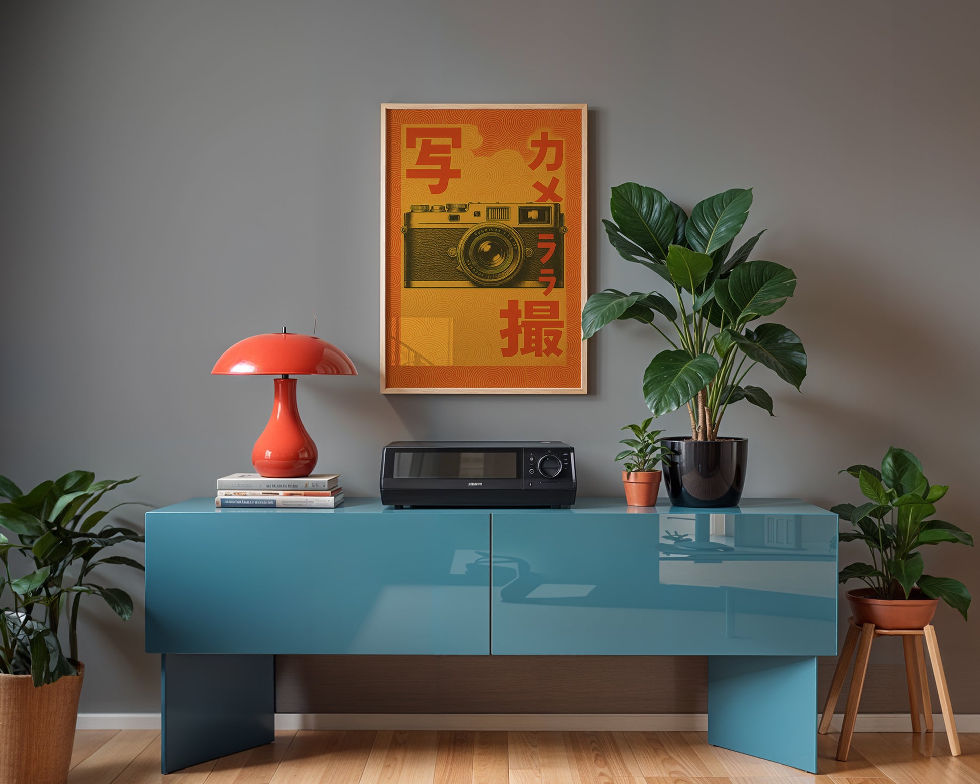 Modern studio interior with a blue hi-fi table, red lamp, and decorative items against a gray wall.