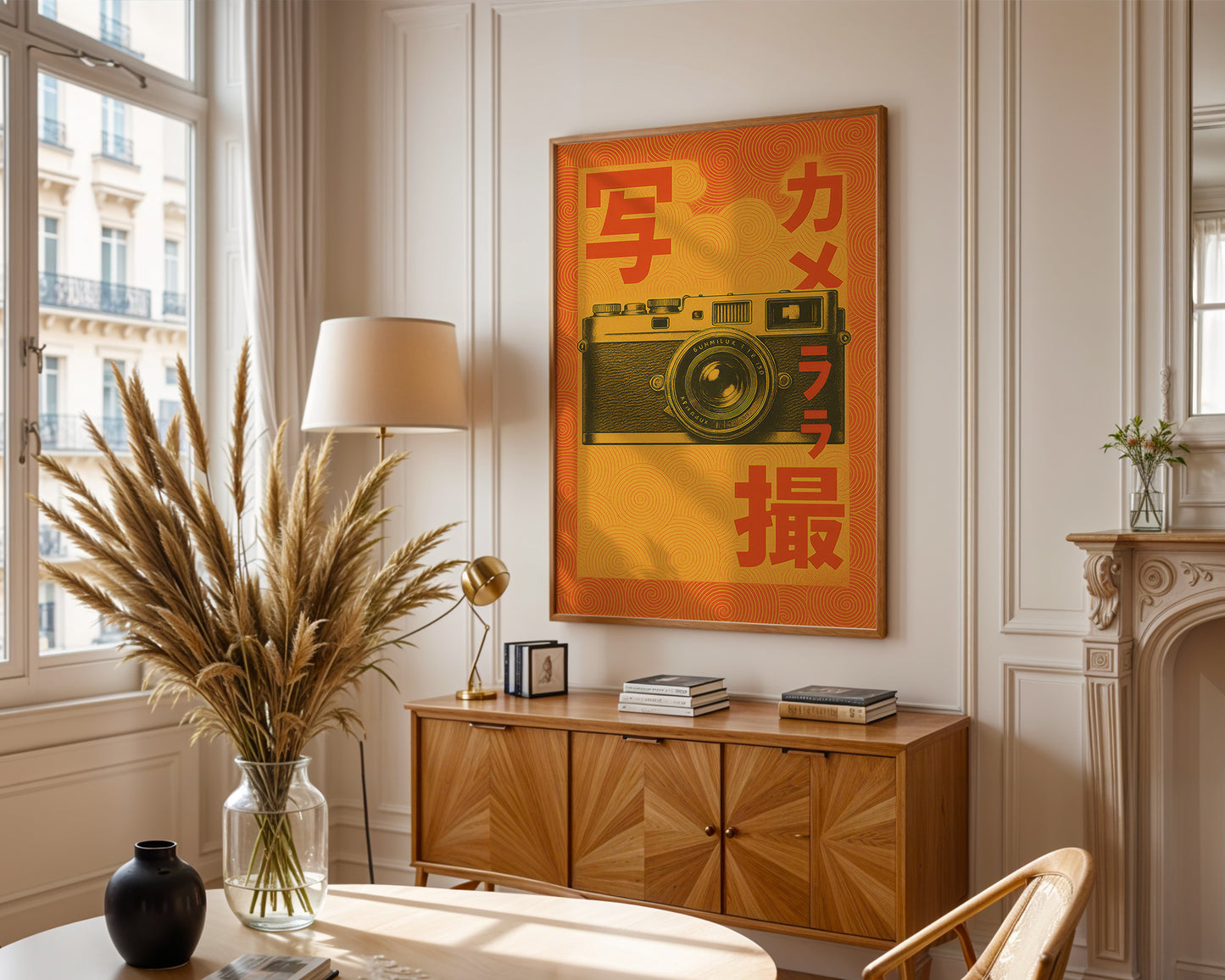 Living room with wooden cabinet, lamp, vase with plants, and framed poster of a camera.