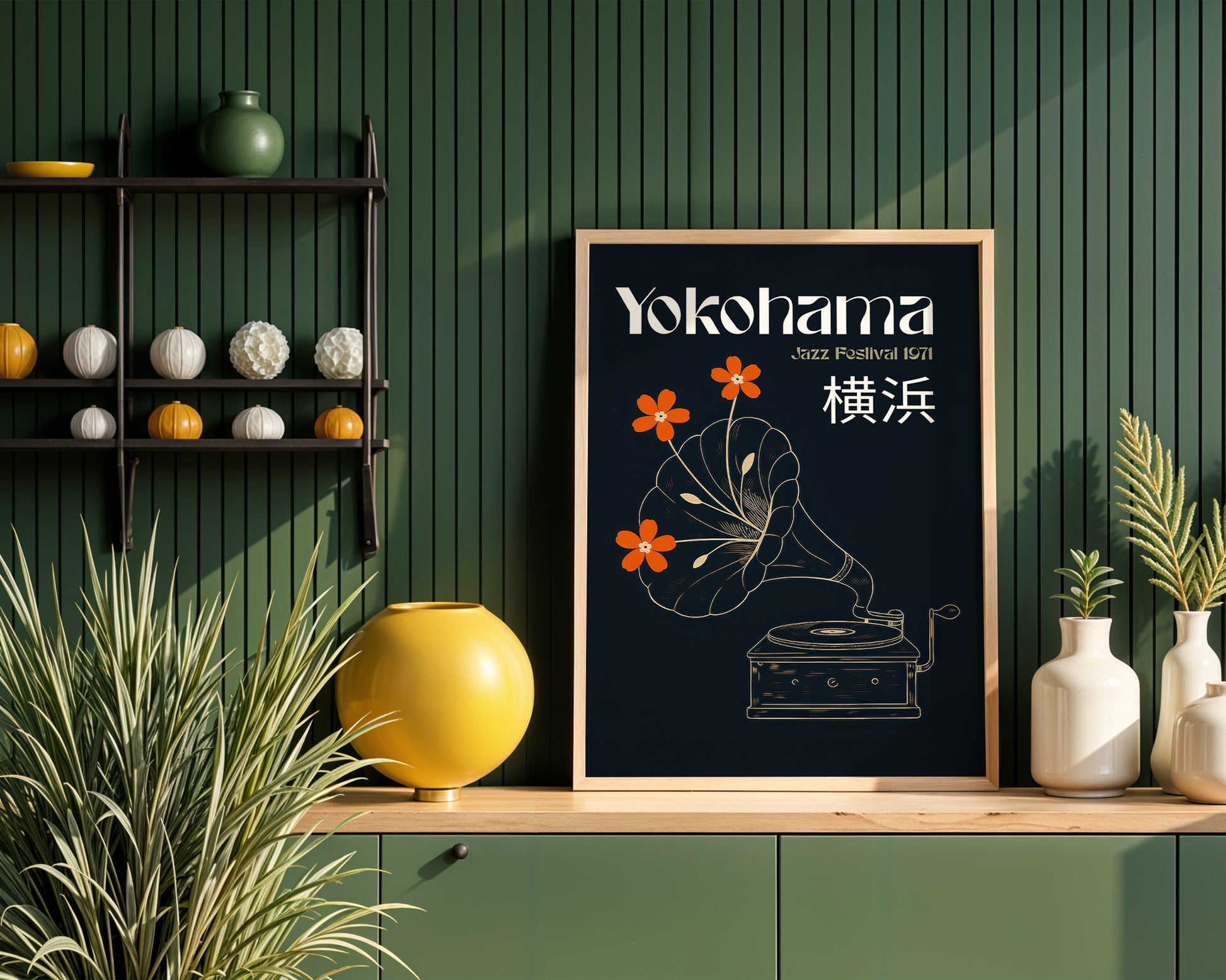 Framed artwork with 'Yokohama' text and floral design on a wooden shelf against a green wall.